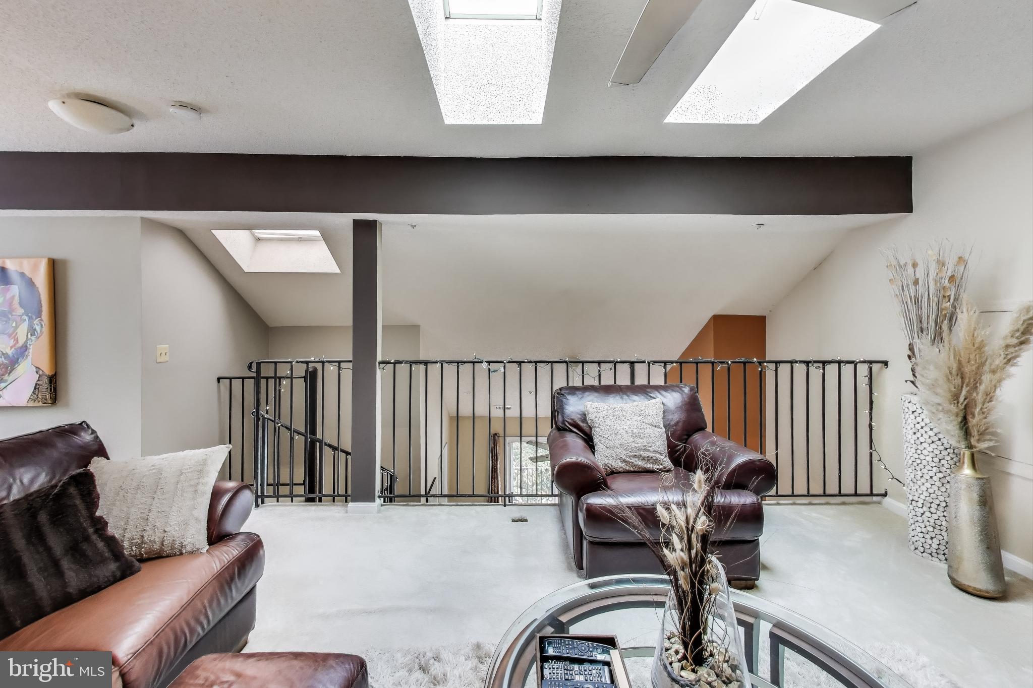 10021 Vanderbilt Circle, Unit 14 Rockville, MD 20850 - Photo 22 of 31 a living room with furniture