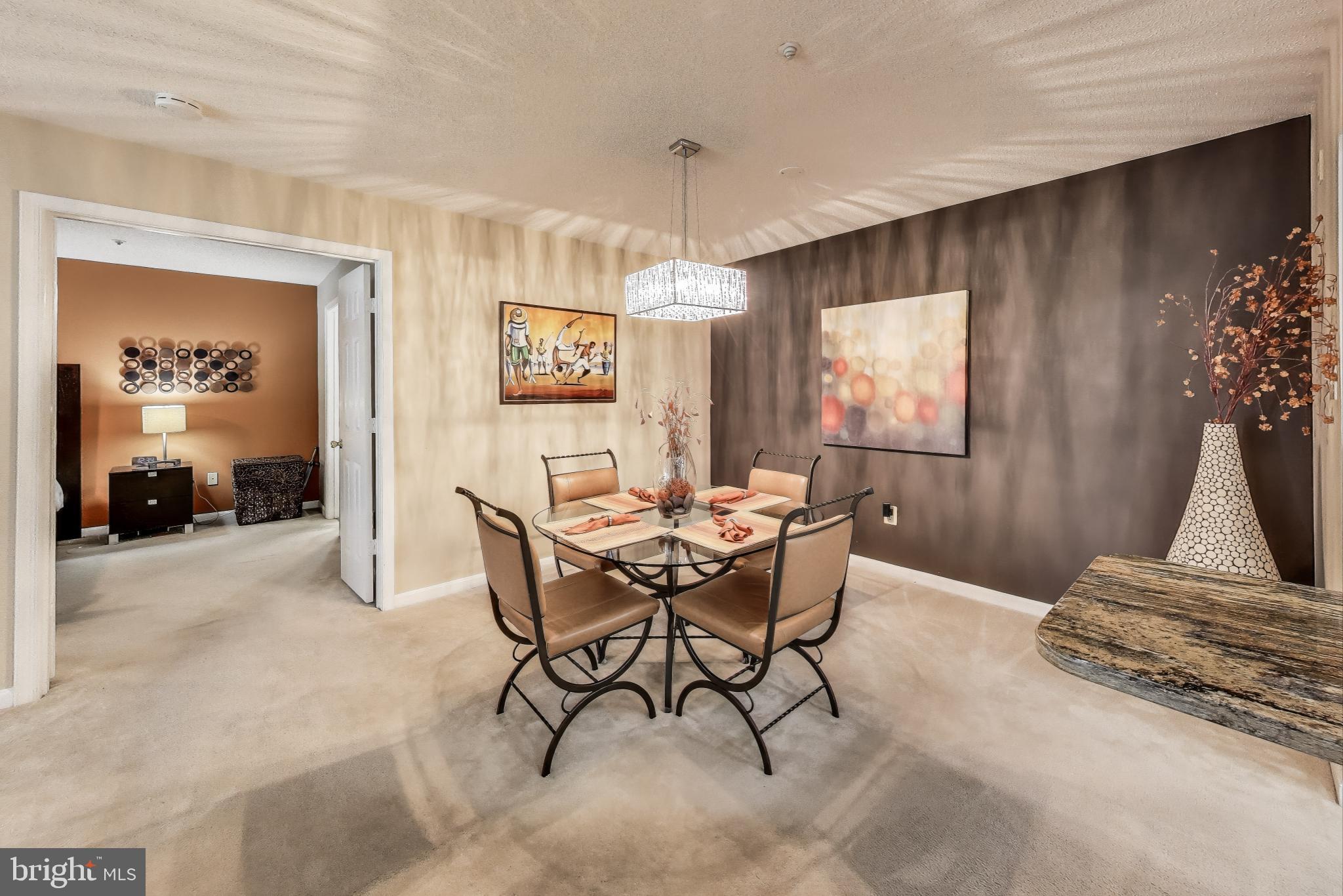 10021 Vanderbilt Circle, Unit 14 Rockville, MD 20850 - Photo 7 of 31 a view of a livingroom and dining room