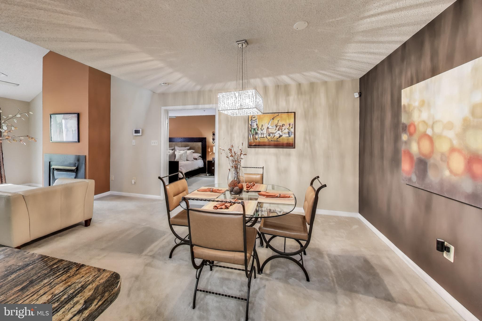10021 Vanderbilt Circle, Unit 14 Rockville, MD 20850 - Photo 9 of 31 a view of a livingroom with furniture and window