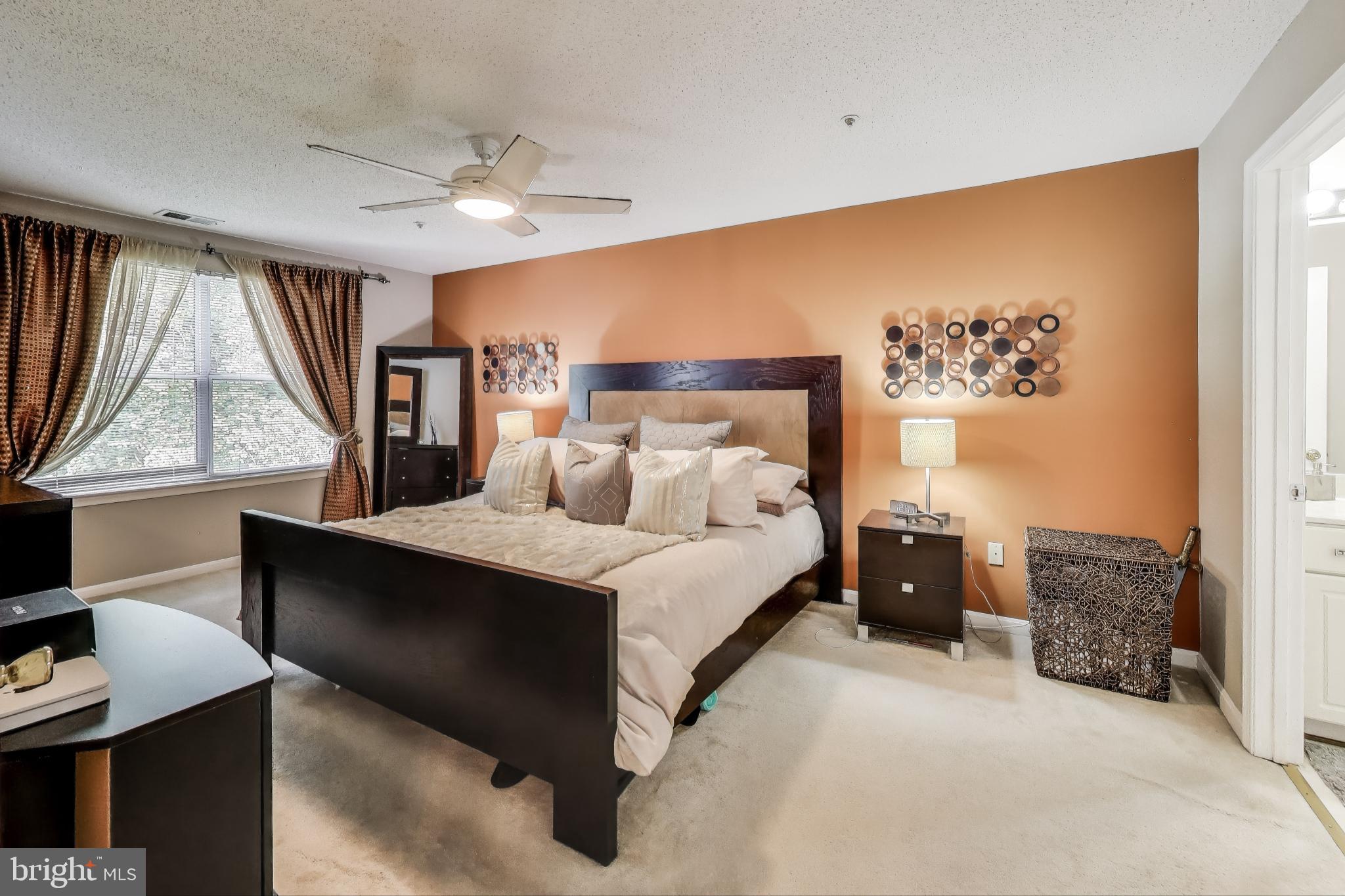 10021 Vanderbilt Circle, Unit 14 Rockville, MD 20850 - Photo 10 of 31 a spacious bedroom with a bed and window