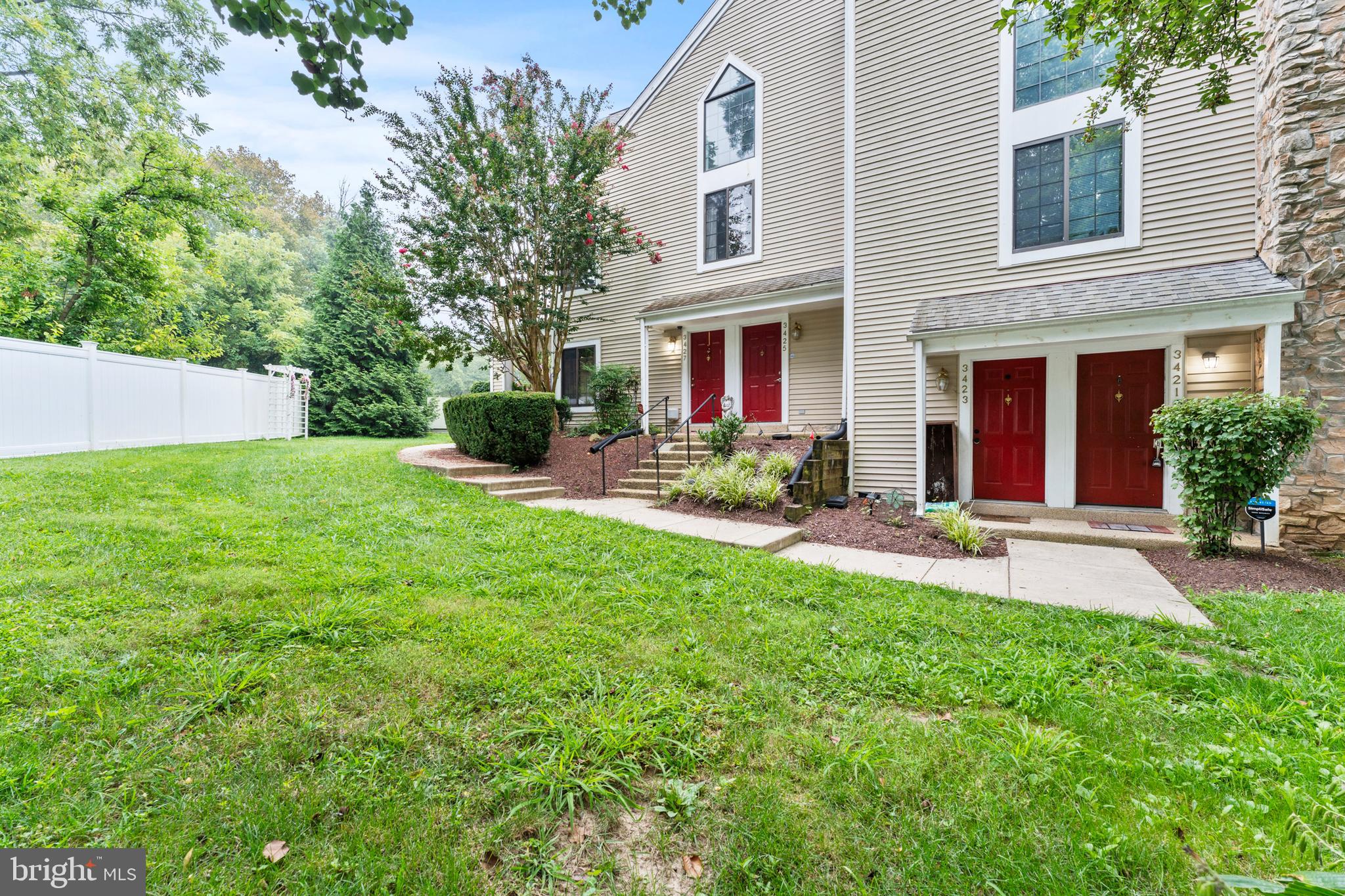3421 Hewitt Avenue, Unit 2202 Silver Spring, MD 20906 - Photo 1 of 31 a view of a house with a yard and plants