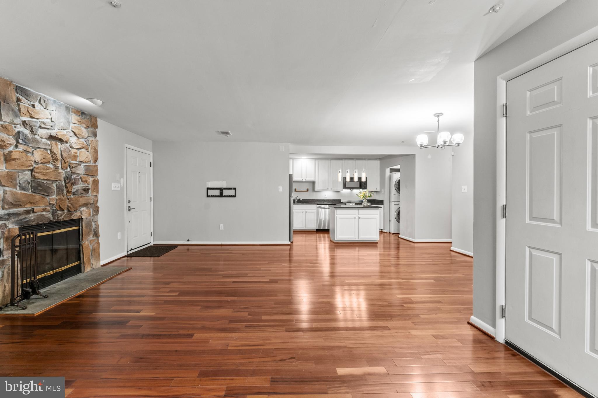 3421 Hewitt Avenue, Unit 2202 Silver Spring, MD 20906 - Photo 12 of 31 a view of empty room with wooden floor and fireplace
