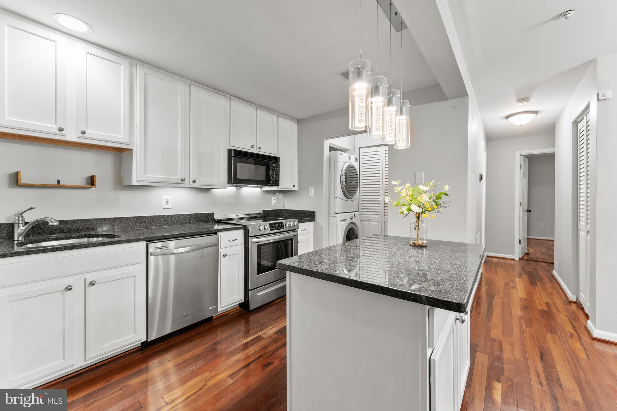 3421 Hewitt Avenue, Unit 2202 Silver Spring, MD 20906 - Photo 14 of 31 a kitchen with granite countertop a sink a counter top space appliances and cabinets