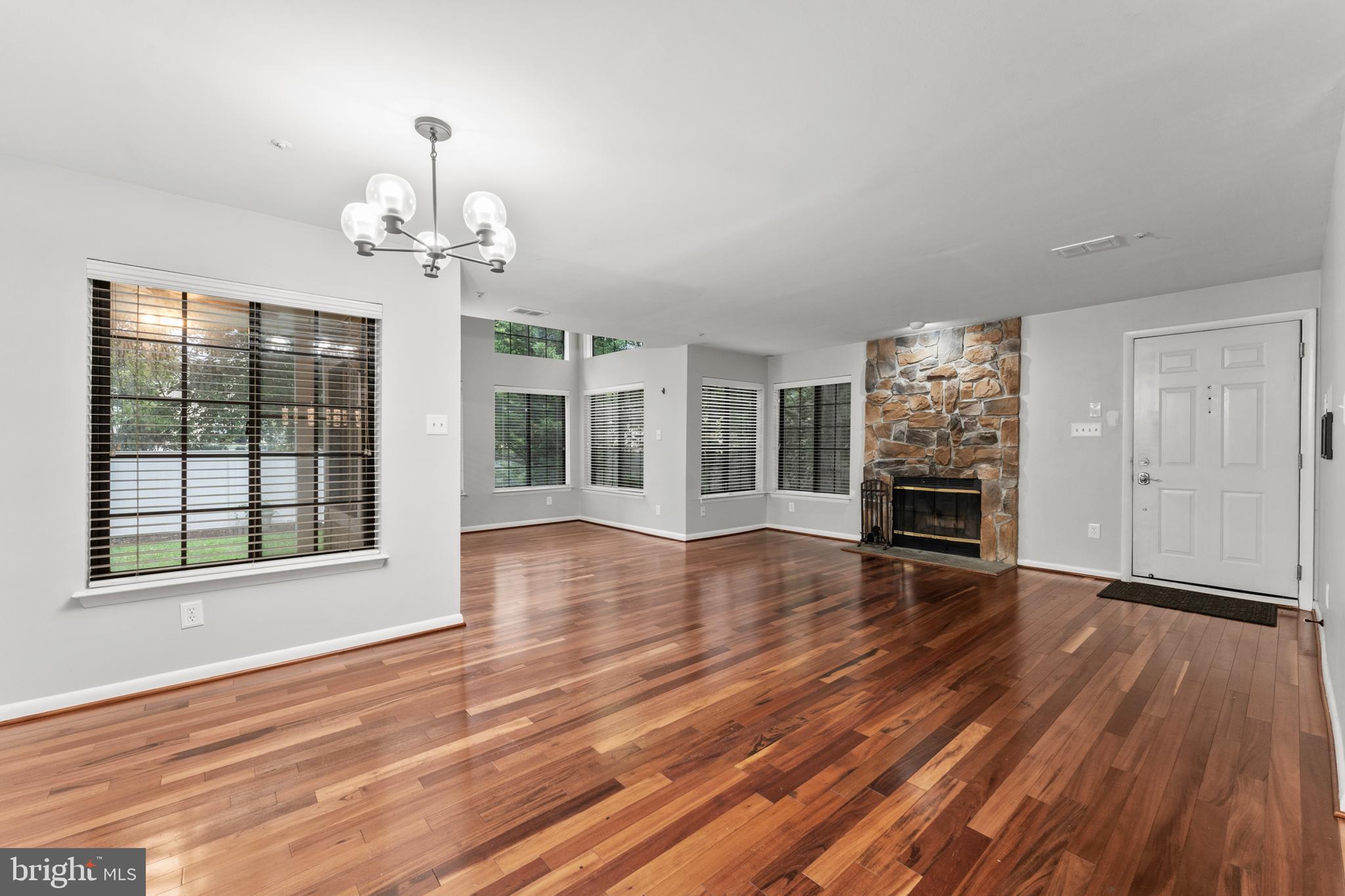 3421 Hewitt Avenue, Unit 2202 Silver Spring, MD 20906 - Photo 15 of 31 a view of a livingroom with wooden floor and a fireplace