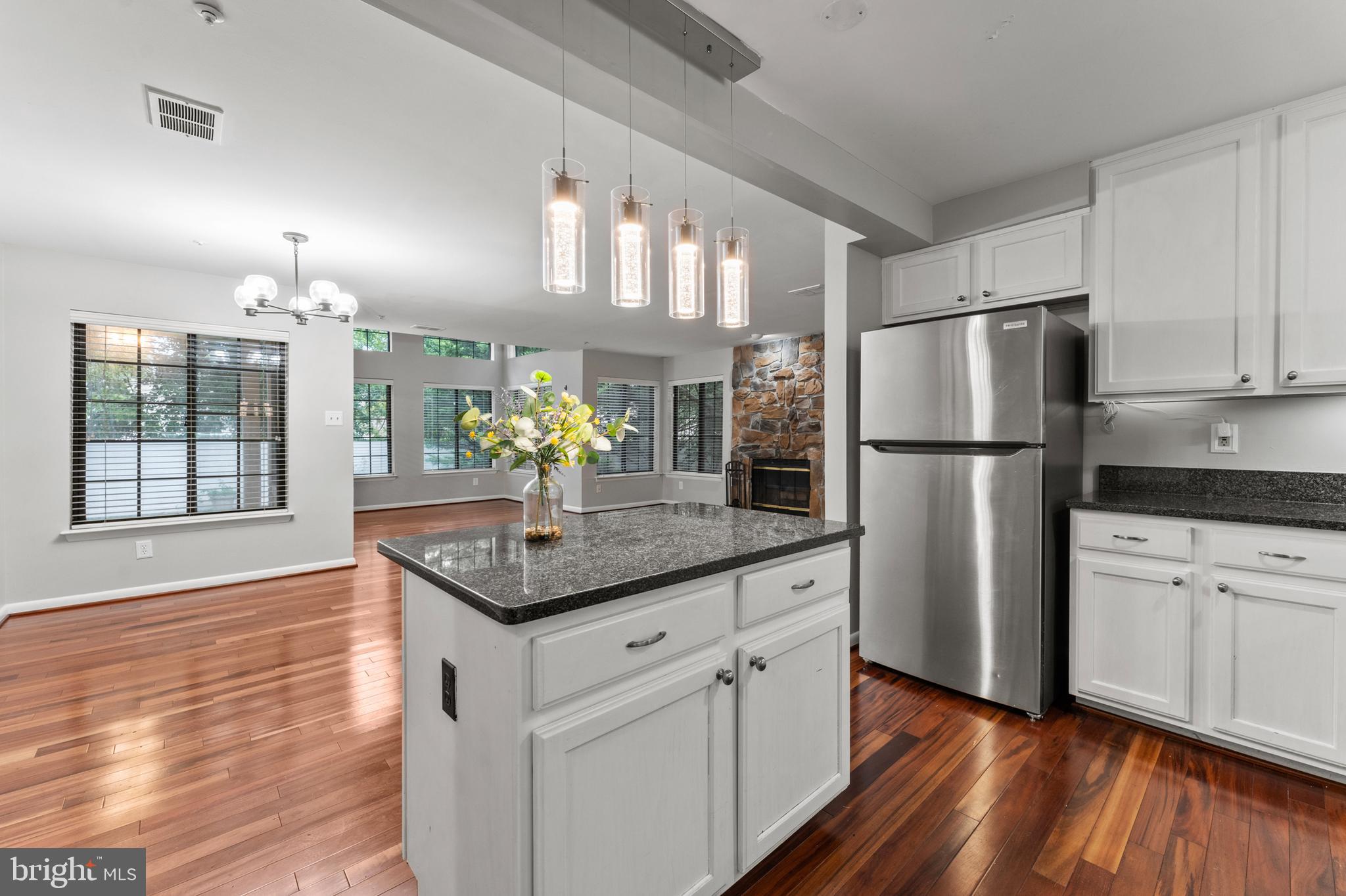 3421 Hewitt Avenue, Unit 2202 Silver Spring, MD 20906 - Photo 19 of 31 a kitchen with granite countertop a refrigerator and a stove top oven