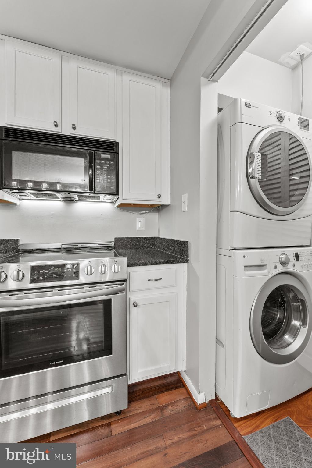 3421 Hewitt Avenue, Unit 2202 Silver Spring, MD 20906 - Photo 20 of 31 a kitchen with stove top oven and cabinets