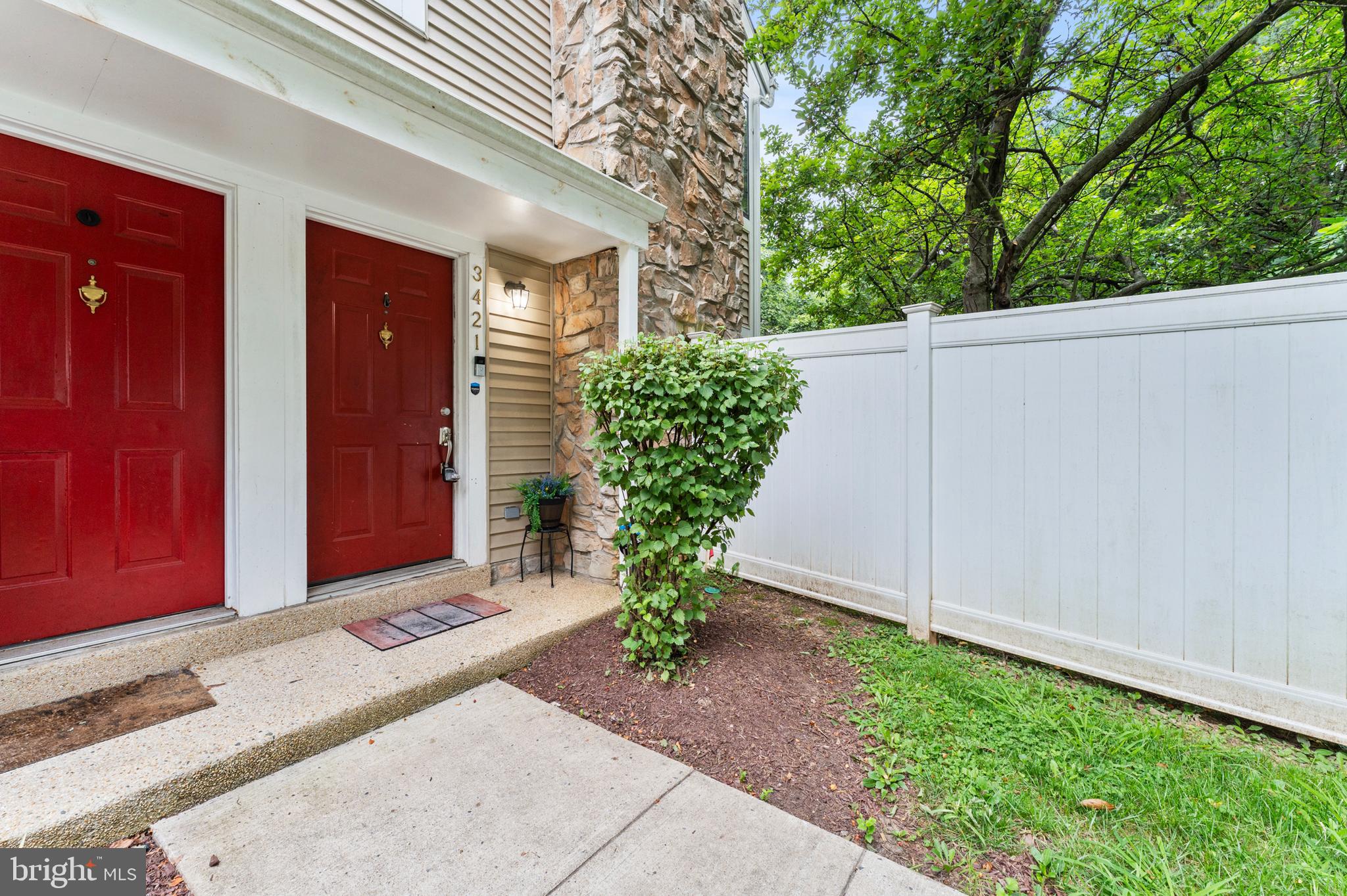 3421 Hewitt Avenue, Unit 2202 Silver Spring, MD 20906 - Photo 2 of 31 a potted plant in front of a door