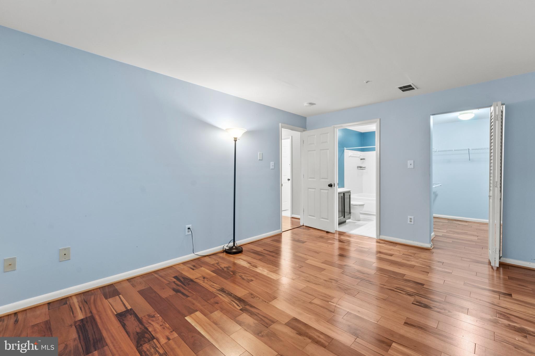 3421 Hewitt Avenue, Unit 2202 Silver Spring, MD 20906 - Photo 24 of 31 a view of an empty room with wooden floor