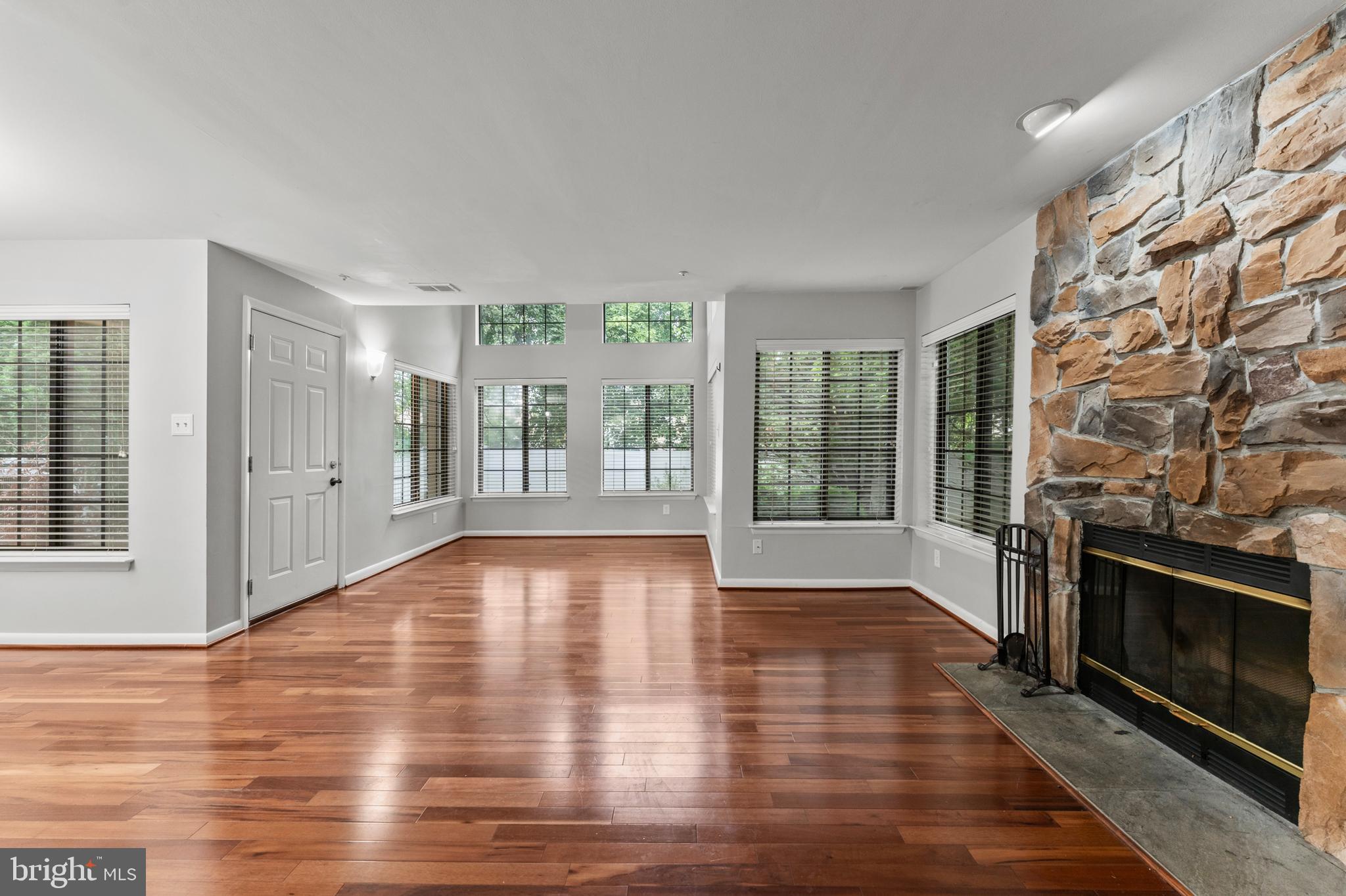 3421 Hewitt Avenue, Unit 2202 Silver Spring, MD 20906 - Photo 4 of 31 a view of an empty room with glass door and wooden floor