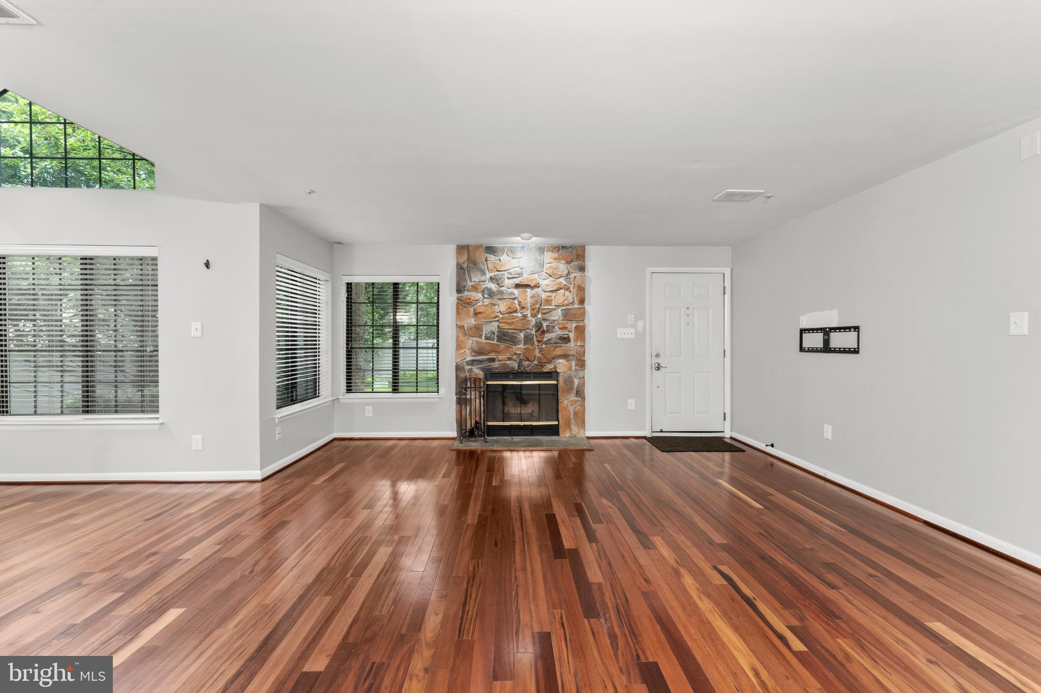 3421 Hewitt Avenue, Unit 2202 Silver Spring, MD 20906 - Photo 5 of 31 wooden floor in an empty room with a window