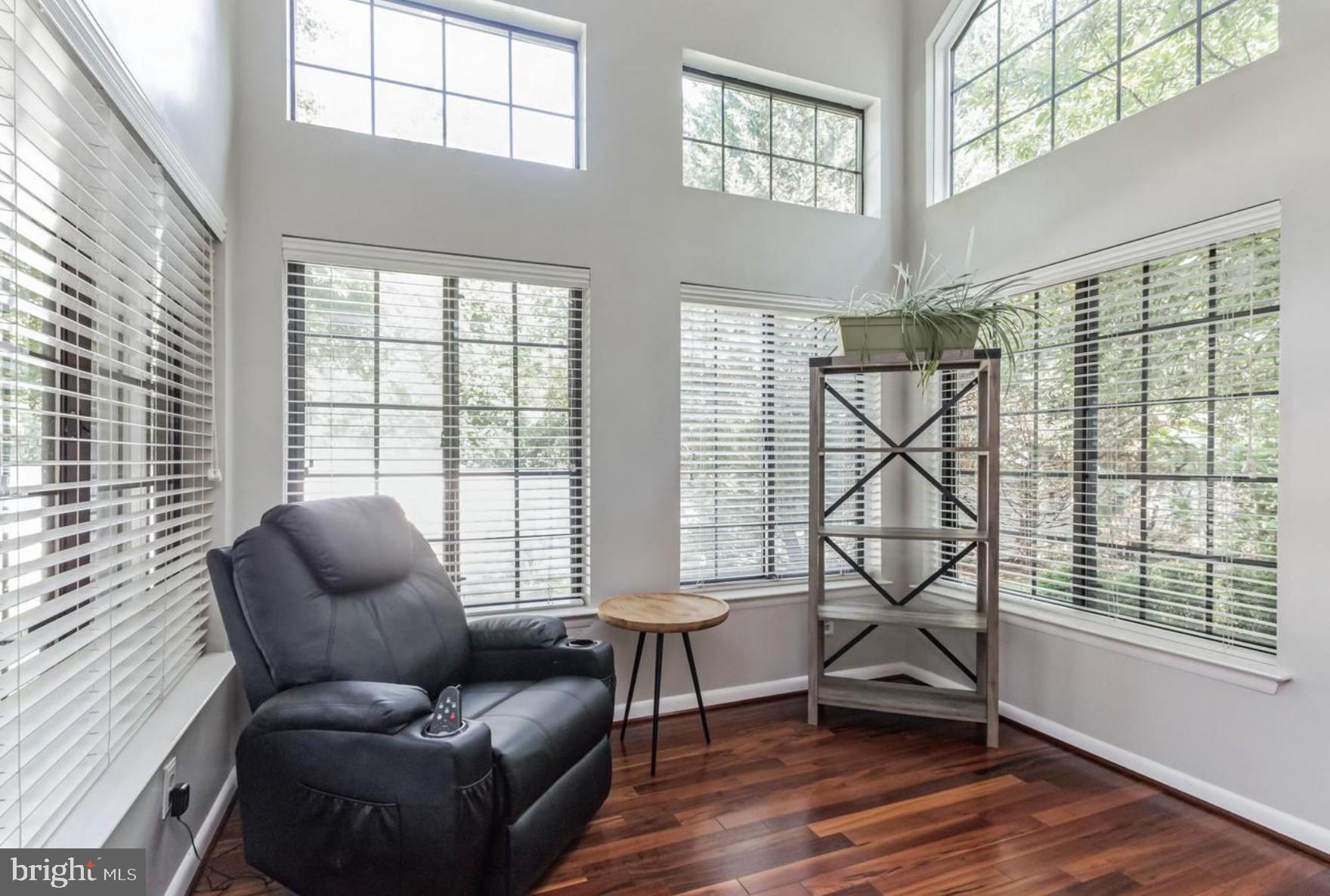 3421 Hewitt Avenue, Unit 2202 Silver Spring, MD 20906 - Photo 10 of 31 a living room with furniture and a floor to ceiling window