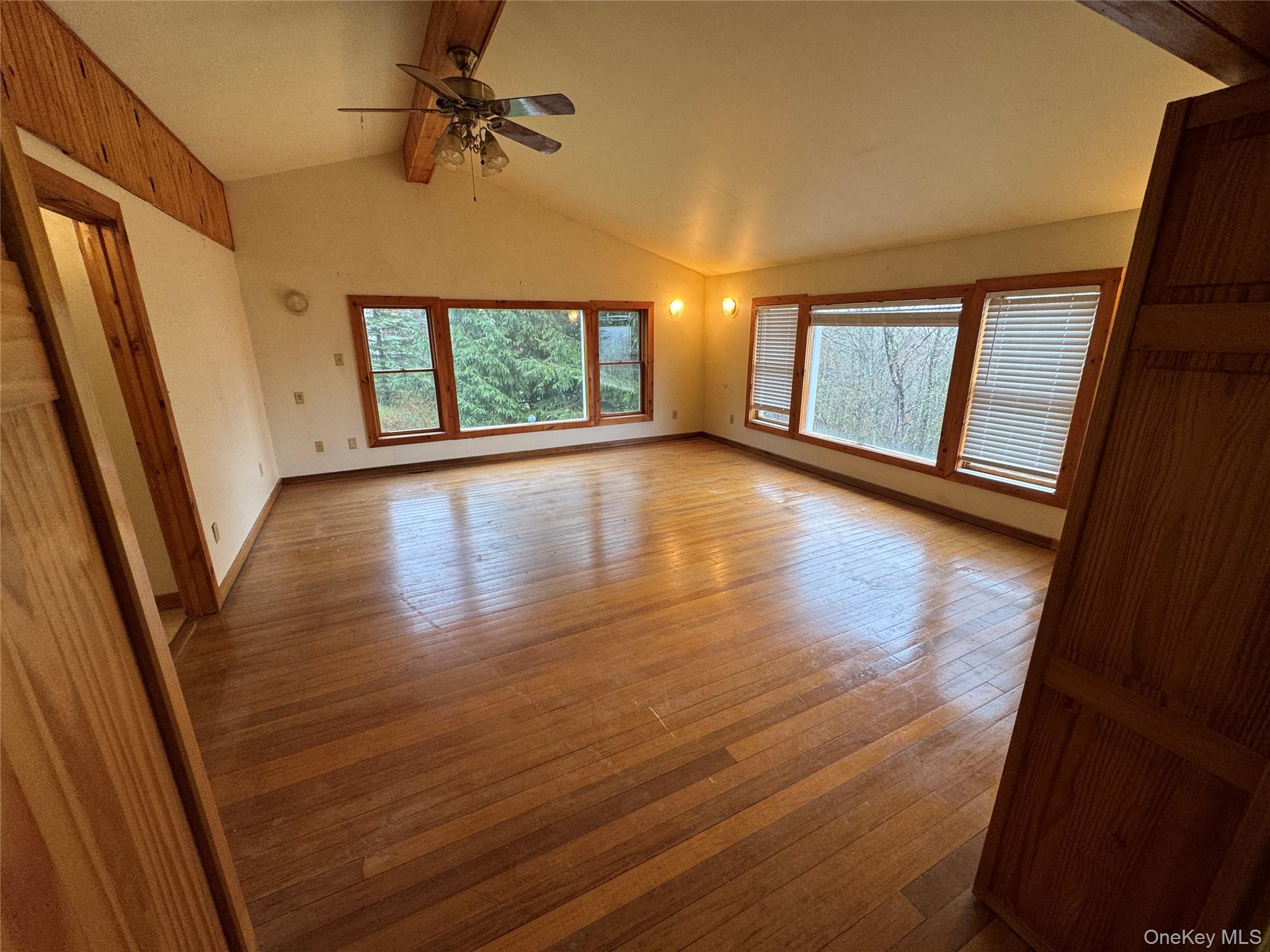 96 White Roe Lake Road Livingston Manor, NY 12758 - Photo 8 of 34 wooden floor in an empty room with a window