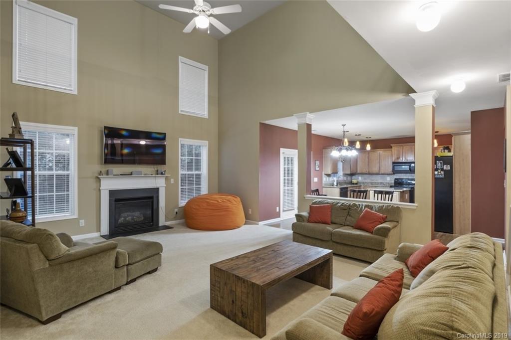 1559 Broderick Street Northwest Concord, NC 28027 - Photo 12 of 29 a living room with furniture and a fireplace