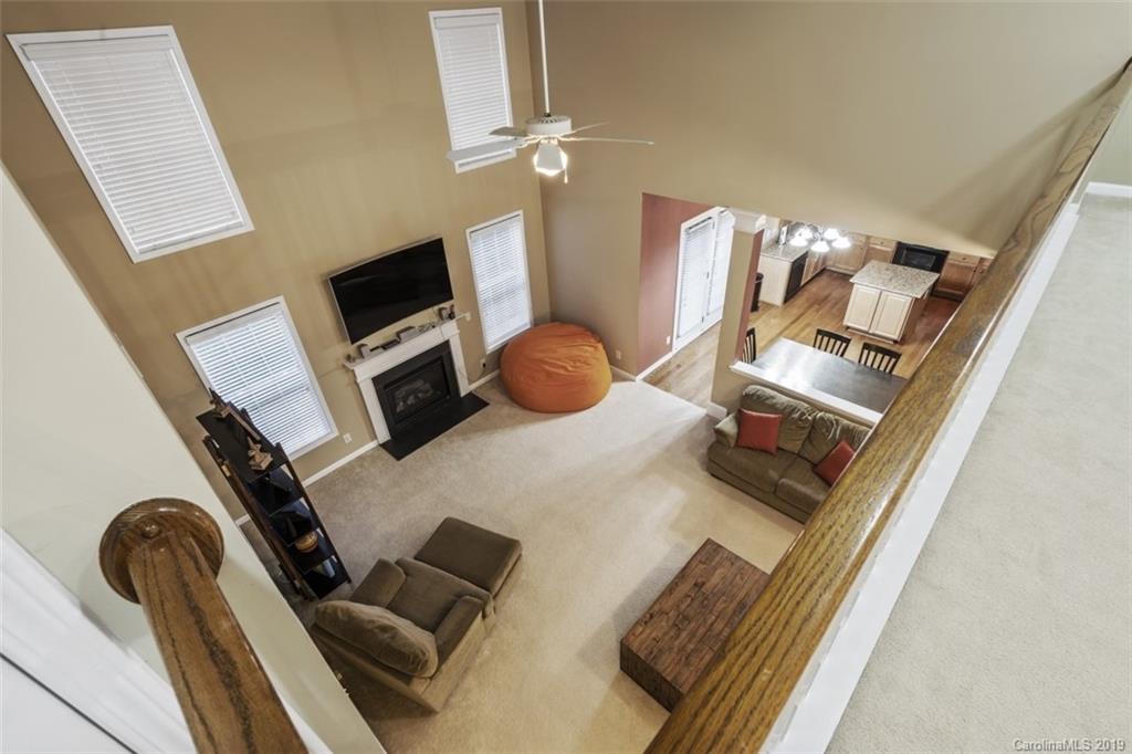 1559 Broderick Street Northwest Concord, NC 28027 - Photo 13 of 29 a bedroom with a bed and cabinets