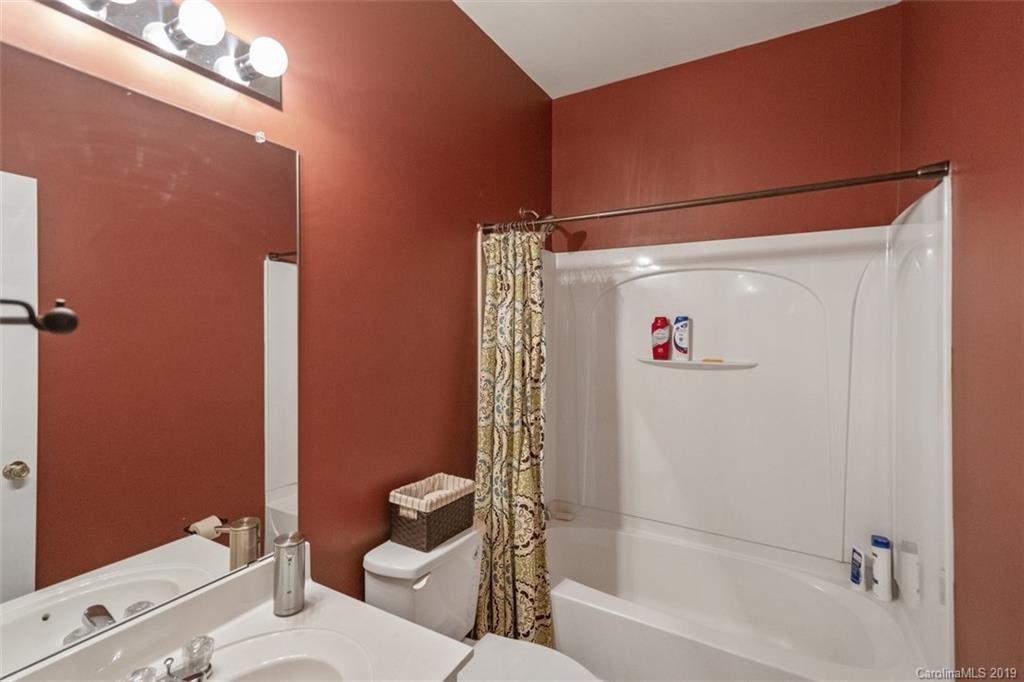 1559 Broderick Street Northwest Concord, NC 28027 - Photo 17 of 29 a bathroom with a shower and a toilet