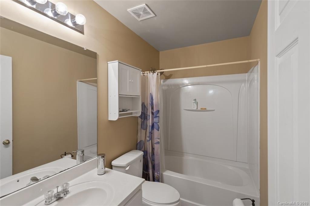 1559 Broderick Street Northwest Concord, NC 28027 - Photo 19 of 29 a bathroom with a sink toilet and shower