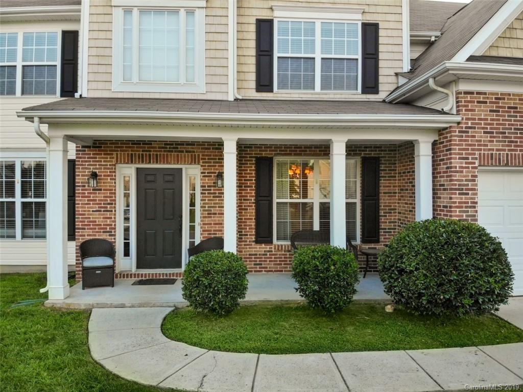1559 Broderick Street Northwest Concord, NC 28027 - Photo 2 of 29 front view of a brick house with a yard