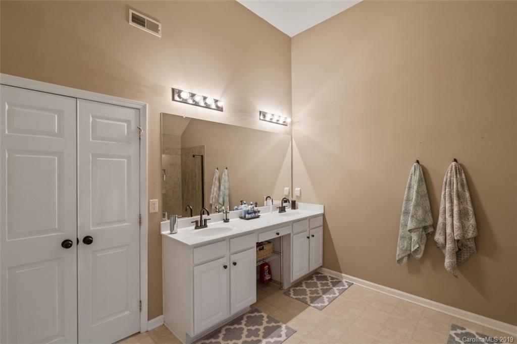 1559 Broderick Street Northwest Concord, NC 28027 - Photo 21 of 29 a bathroom with a sink and a mirror