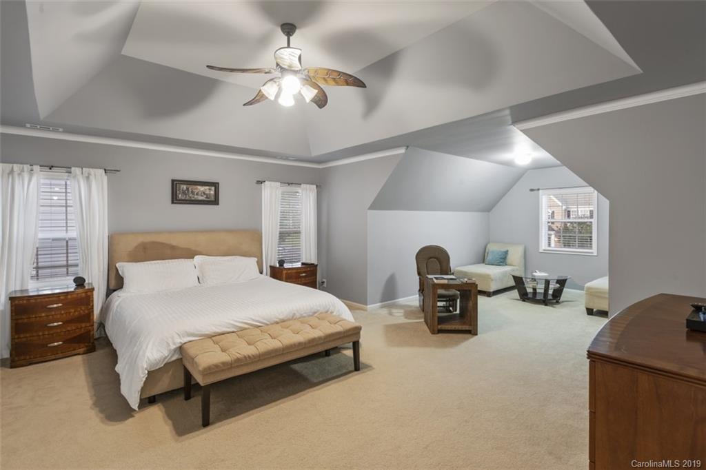 1559 Broderick Street Northwest Concord, NC 28027 - Photo 24 of 29 a bedroom with a bed couch and a window
