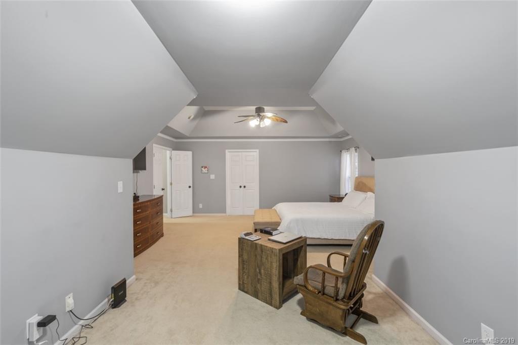 1559 Broderick Street Northwest Concord, NC 28027 - Photo 25 of 29 a room with furniture and chandelier