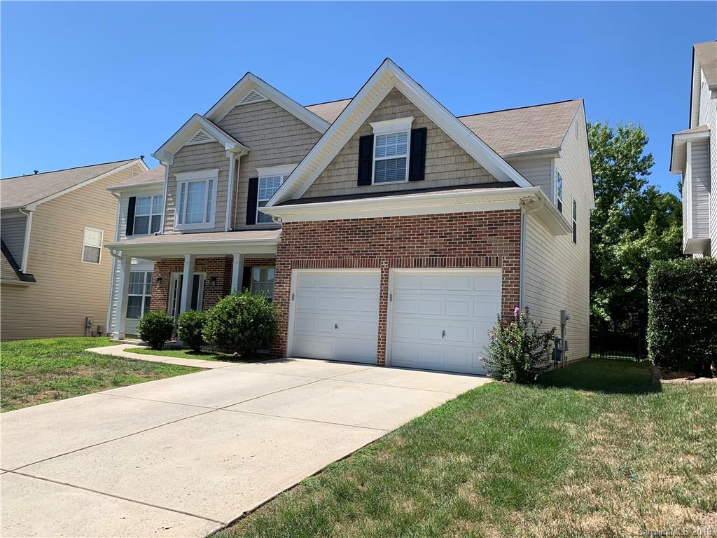 1559 Broderick Street Northwest Concord, NC 28027 - Photo 3 of 29 a front view of a house with a yard and garage