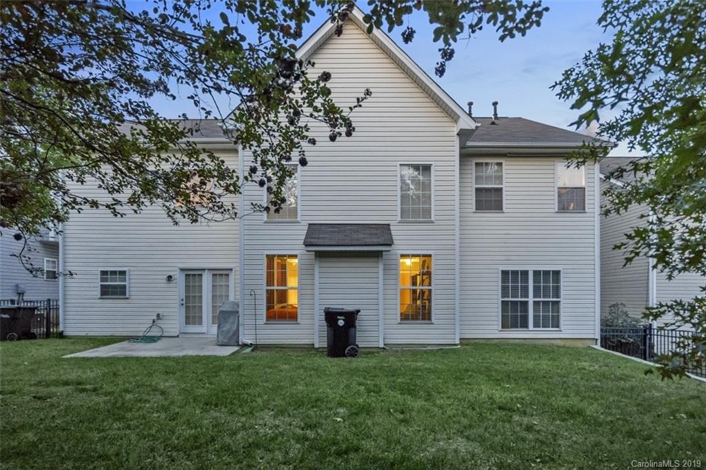 1559 Broderick Street Northwest Concord, NC 28027 - Photo 5 of 29 a front view of a house with a garden