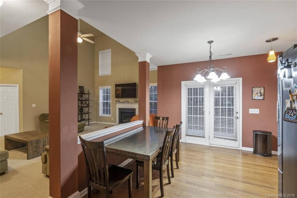 1559 Broderick Street Northwest Concord, NC 28027 - Photo 9 of 29 a view of a dining room with furniture and wooden floor