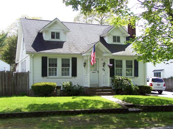 29 Partridge Road Weymouth, MA 02190 - Photo 1 of 15 a front view of a house with a yard and potted plants