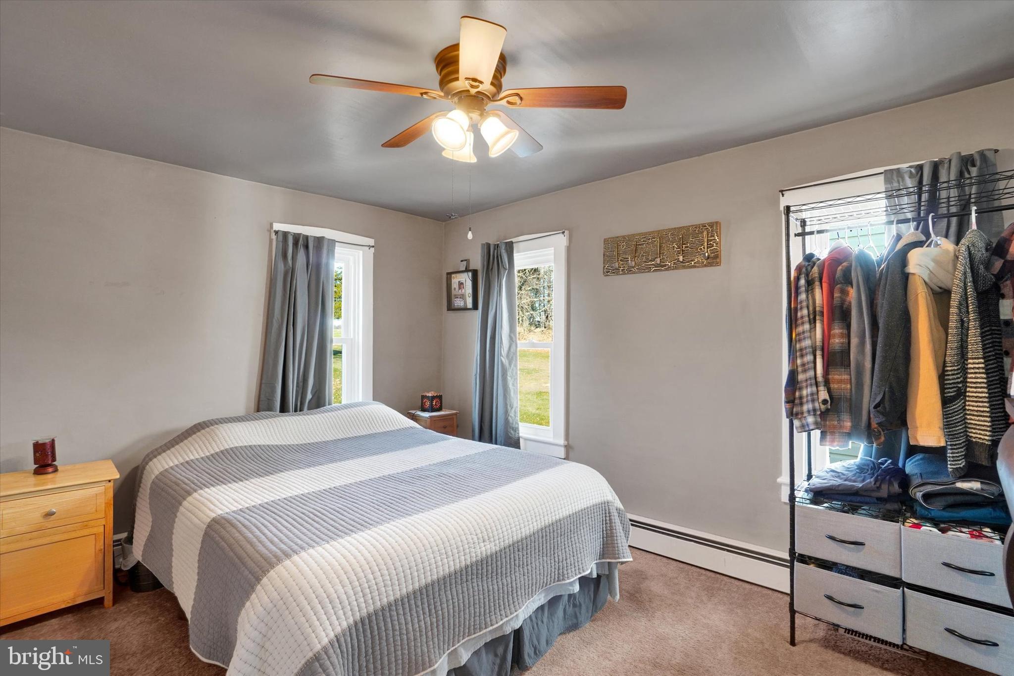 48 High Street Felton, PA 17322 - Photo 14 of 28 a bedroom with a bed and a chandelier