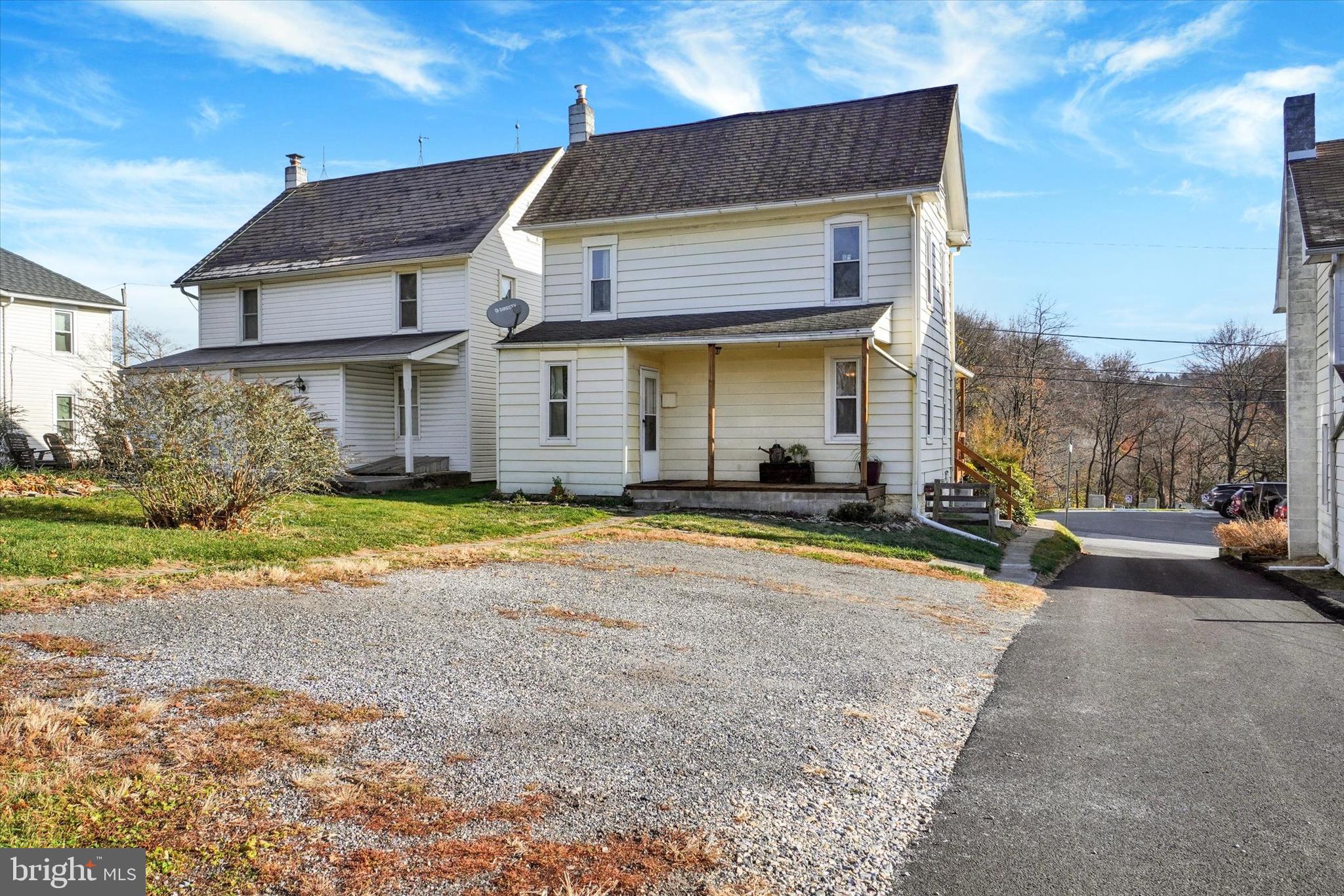 48 High Street Felton, PA 17322 - Photo 26 of 28 a view of a white house with a swimming pool and porch