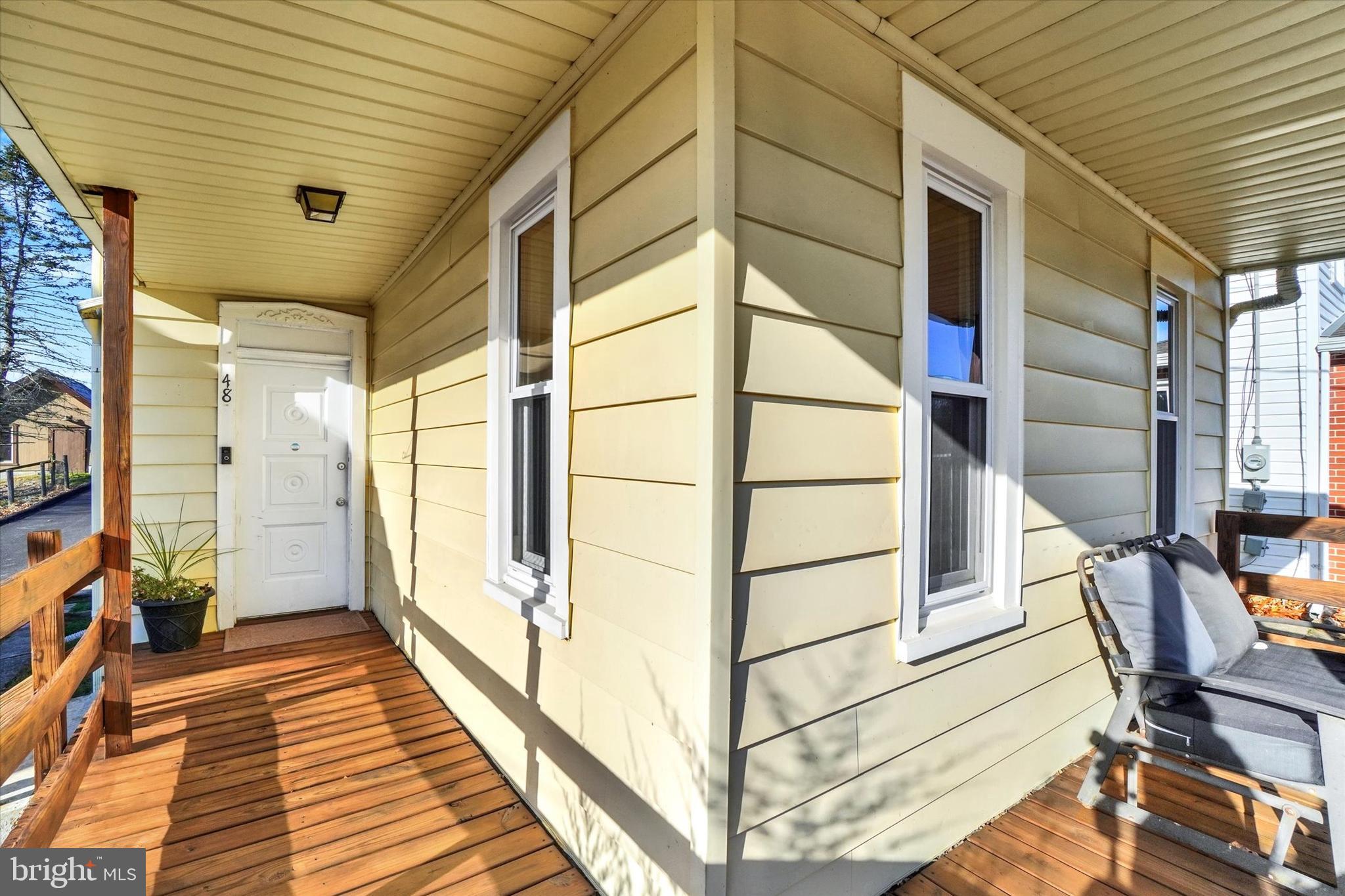 48 High Street Felton, PA 17322 - Photo 4 of 28 a view of a balcony with wooden floor and furniture