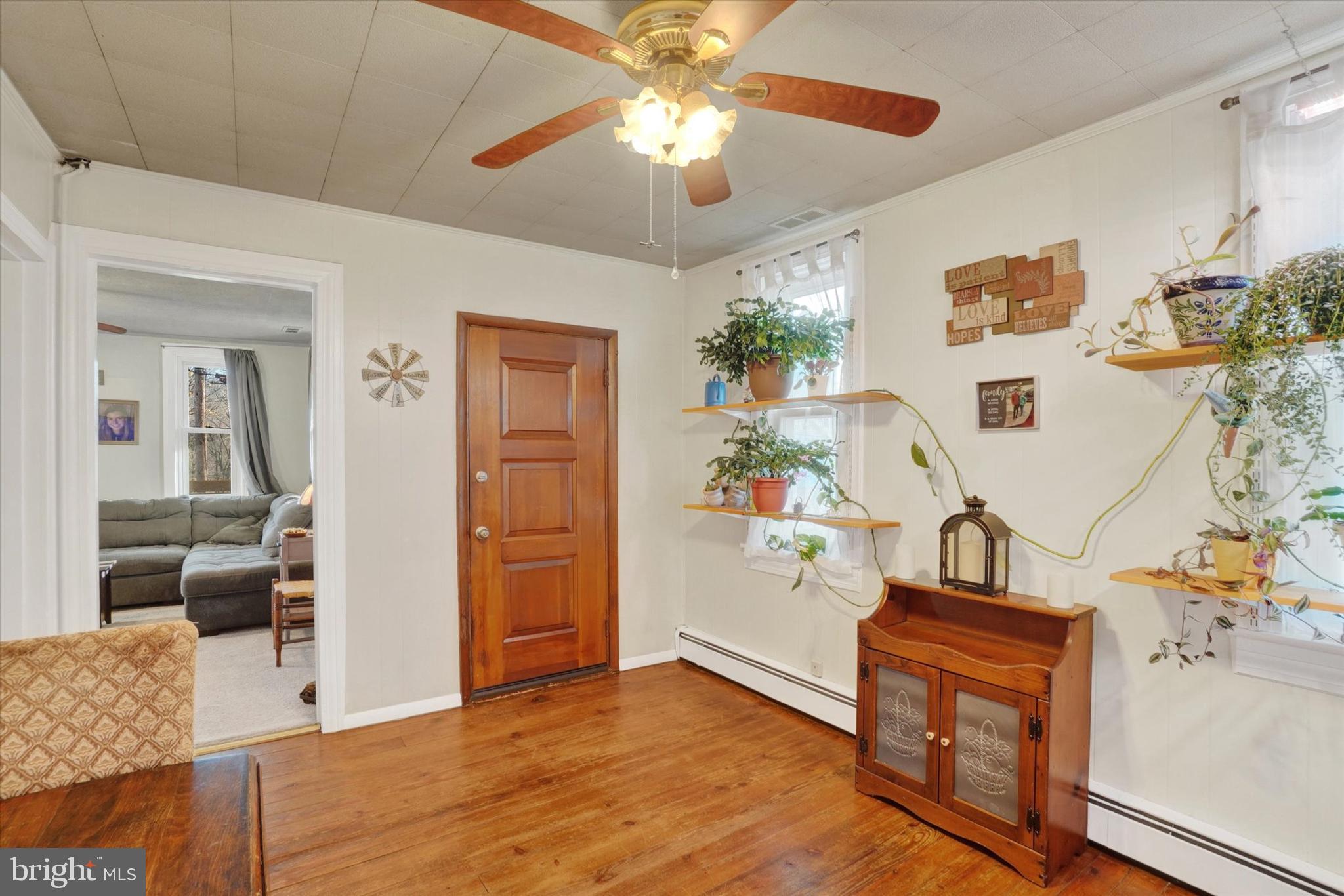 48 High Street Felton, PA 17322 - Photo 6 of 28 wooden floor with furniture and a chandelier fan