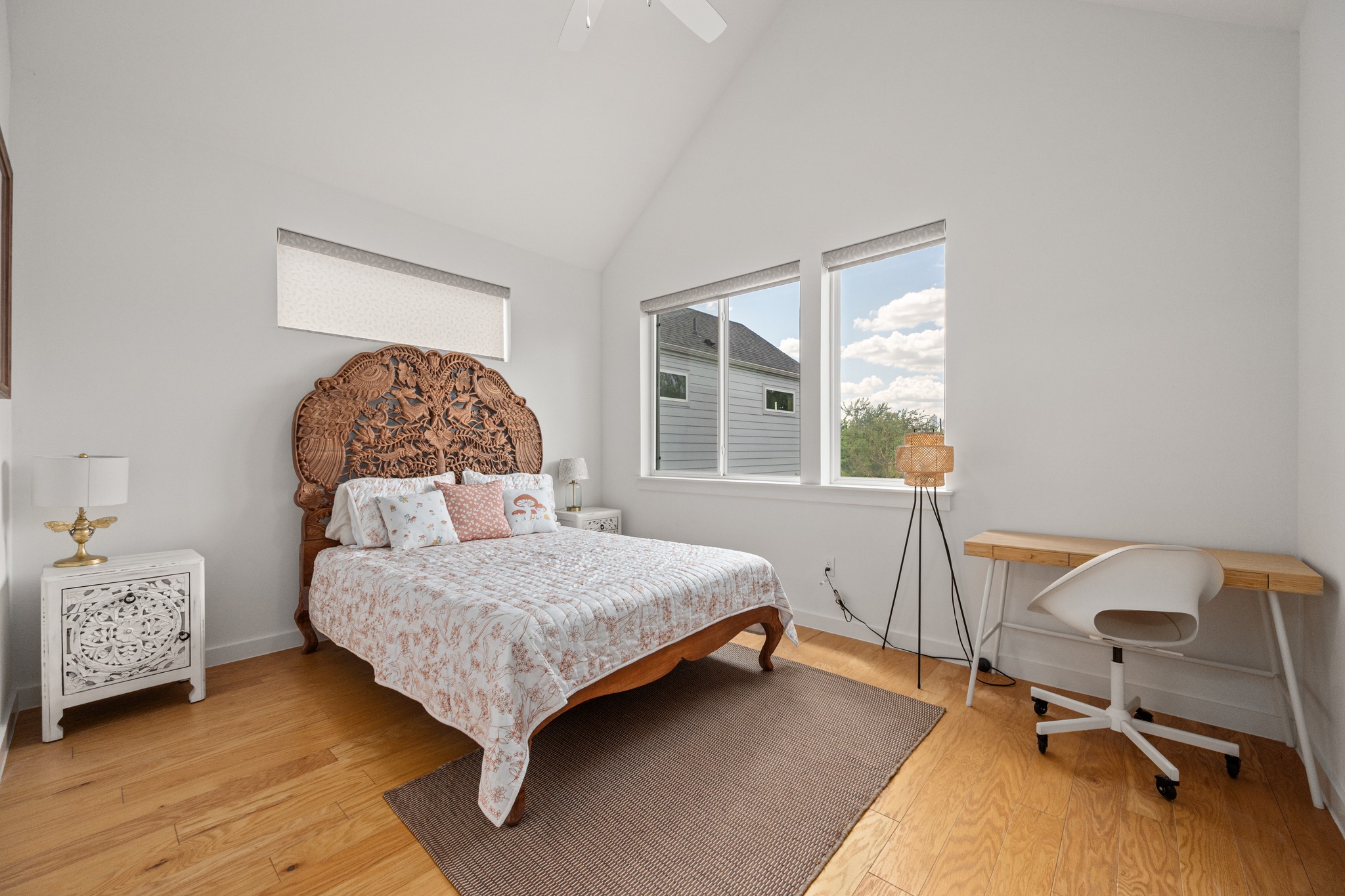 1190 Sarabeth Way Austin, TX 78721 - Photo 12 of 22 Vaulted ceilings and warm hardwood flooring define this inviting bedroom space.