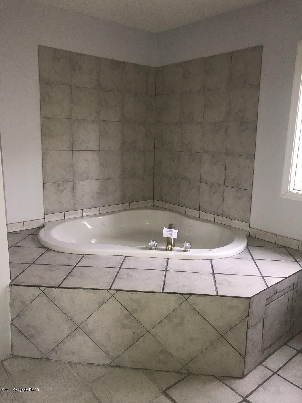 1107 Cameron Road Effort, PA 18330 - Photo 13 of 13 a bathroom with a bathtub