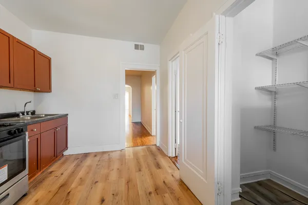a view of a kitchen from the hallway