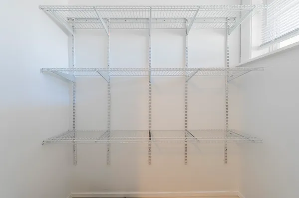 a view of a room with racks on the wall