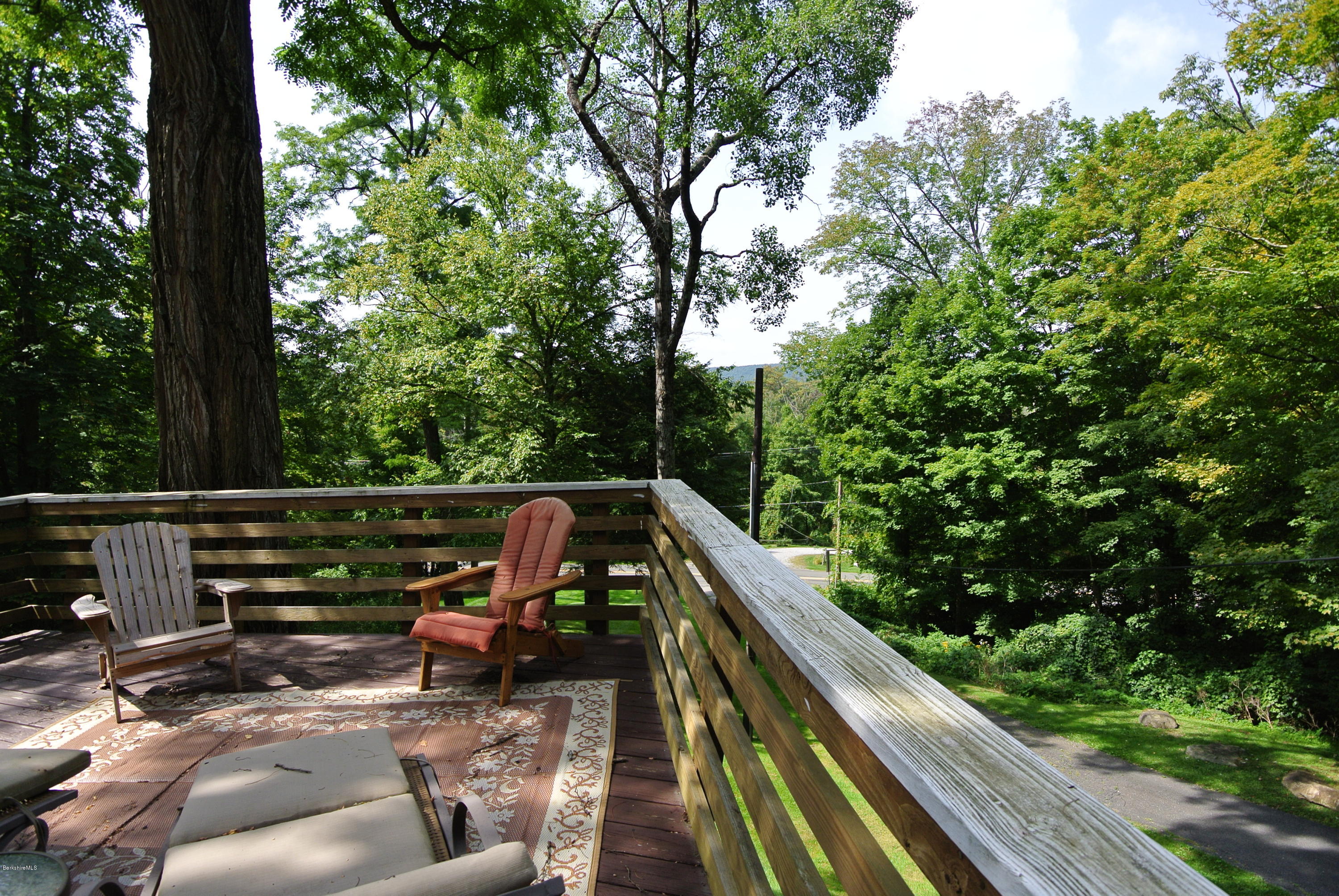 6 Mahkeenac Road Stockbridge, MA 01262 - Photo 2 of 20 a view of balcony with wooden floor and fence