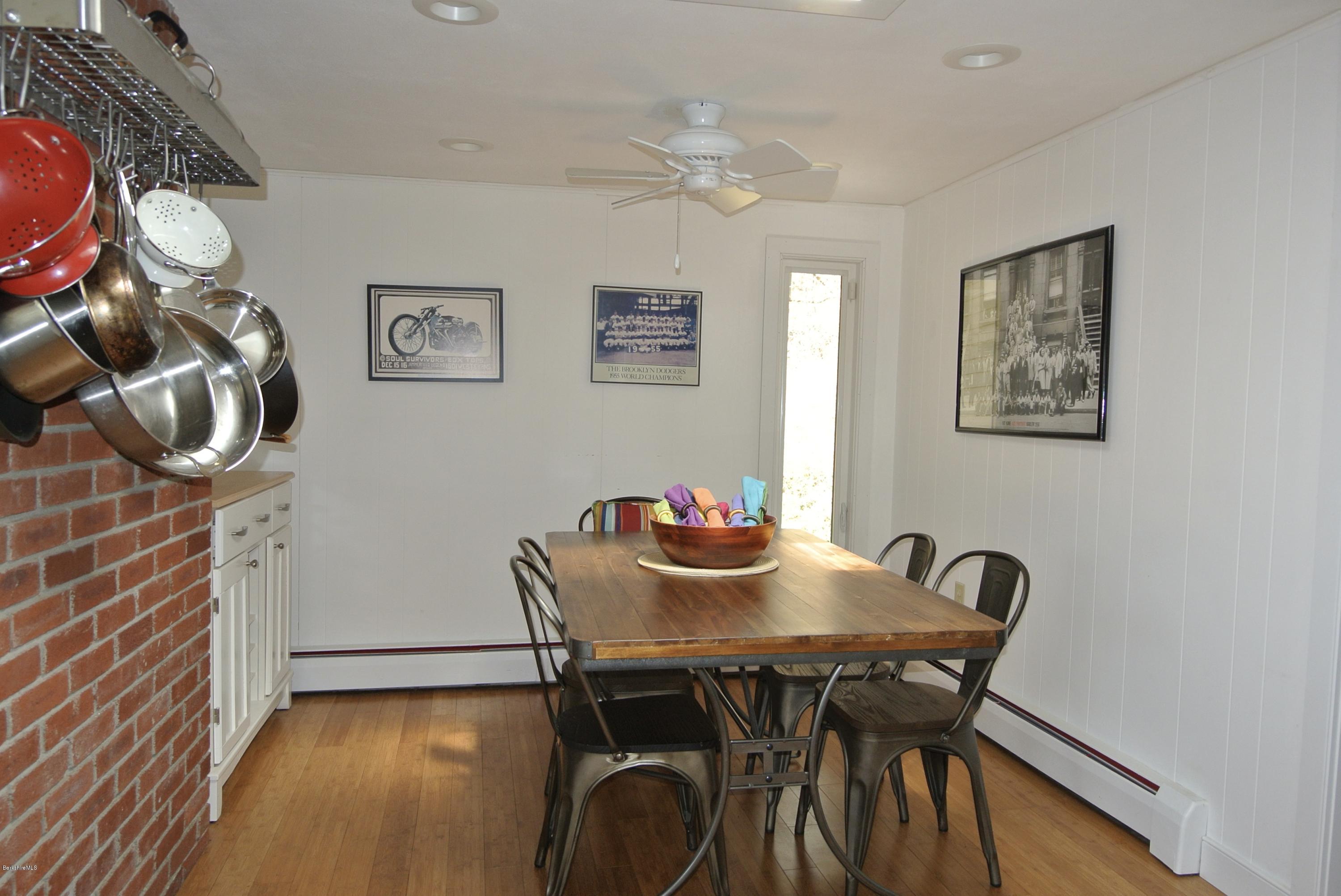 6 Mahkeenac Road Stockbridge, MA 01262 - Photo 9 of 20 a view of a dining room with furniture and wooden floor