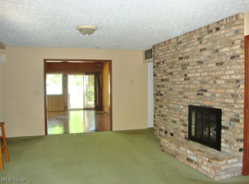 5698 Rock Point Circle North Ridgeville, OH 44039 - Photo 2 of 25 The family room is open to the kitchen and the sunroom.
