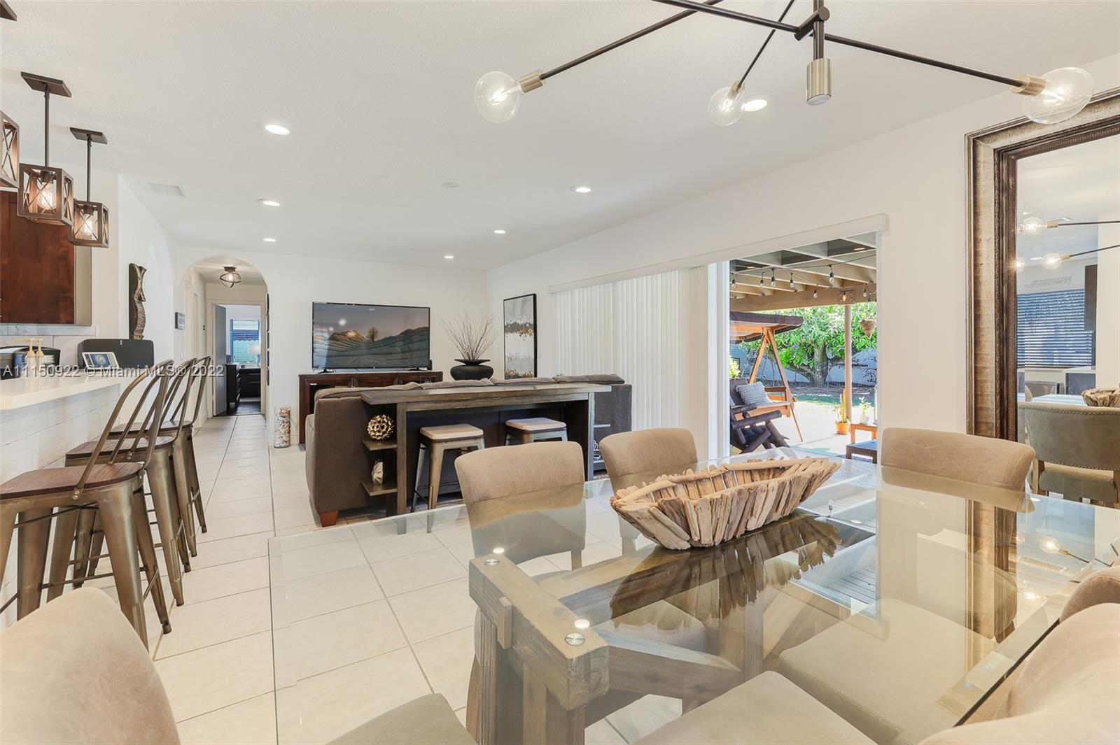 15534 Southwest 153rd Street Miami, FL 33187 - Photo 14 of 44 a view of a dining room with furniture