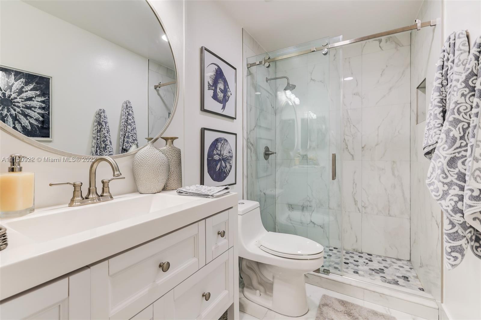15534 Southwest 153rd Street Miami, FL 33187 - Photo 20 of 44 a bathroom with a sink toilet a shower and a mirror