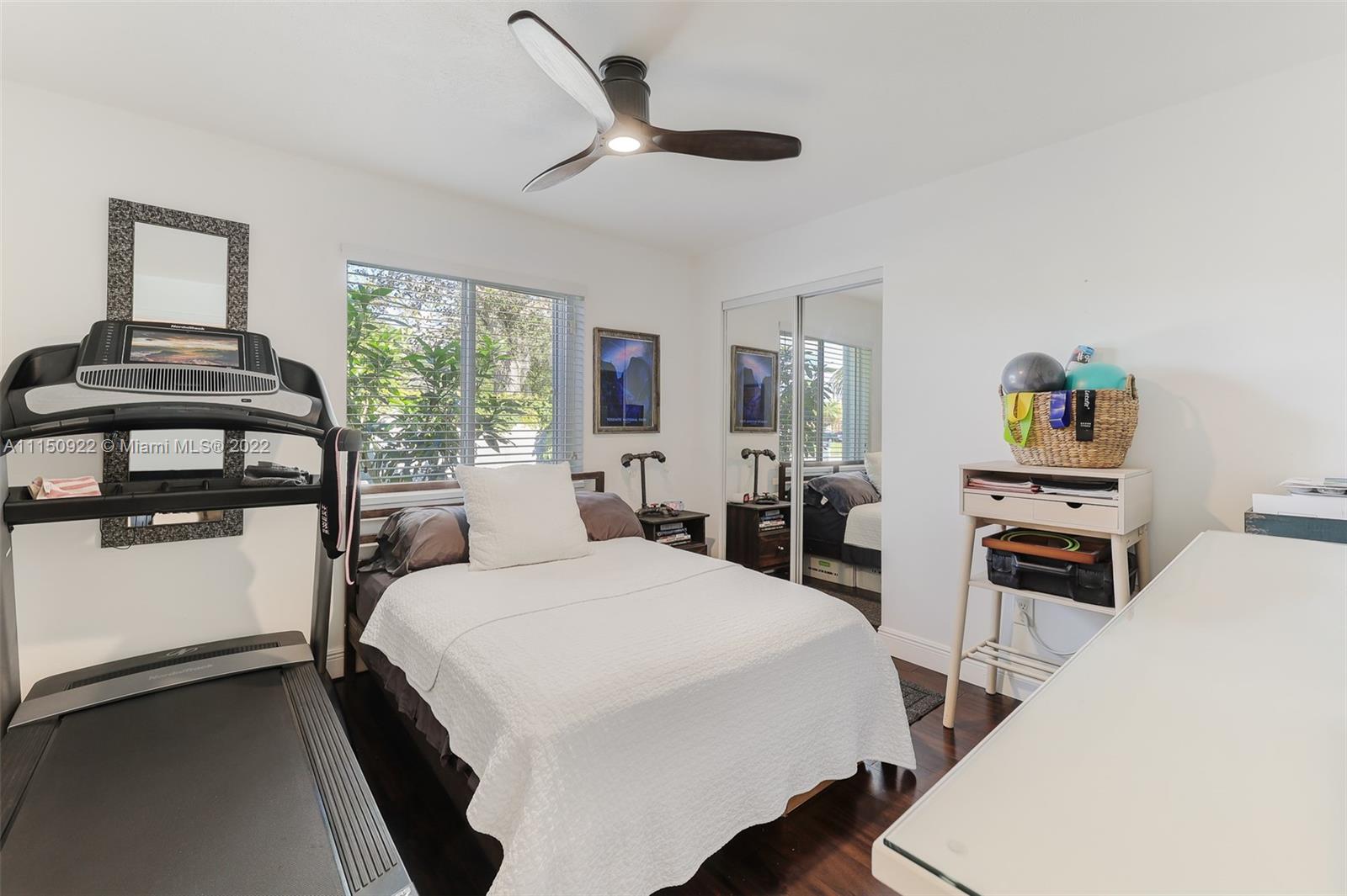 15534 Southwest 153rd Street Miami, FL 33187 - Photo 21 of 44 a bedroom with a bed and a dresser