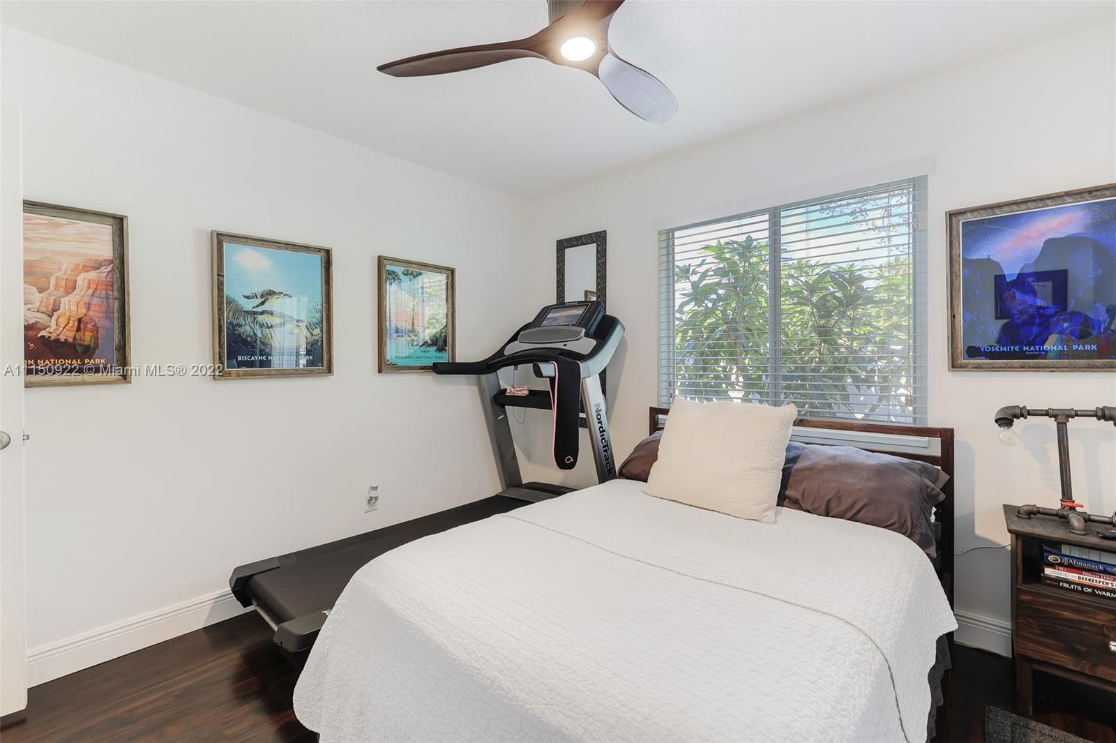 15534 Southwest 153rd Street Miami, FL 33187 - Photo 22 of 44 a bedroom with a bed and a large window
