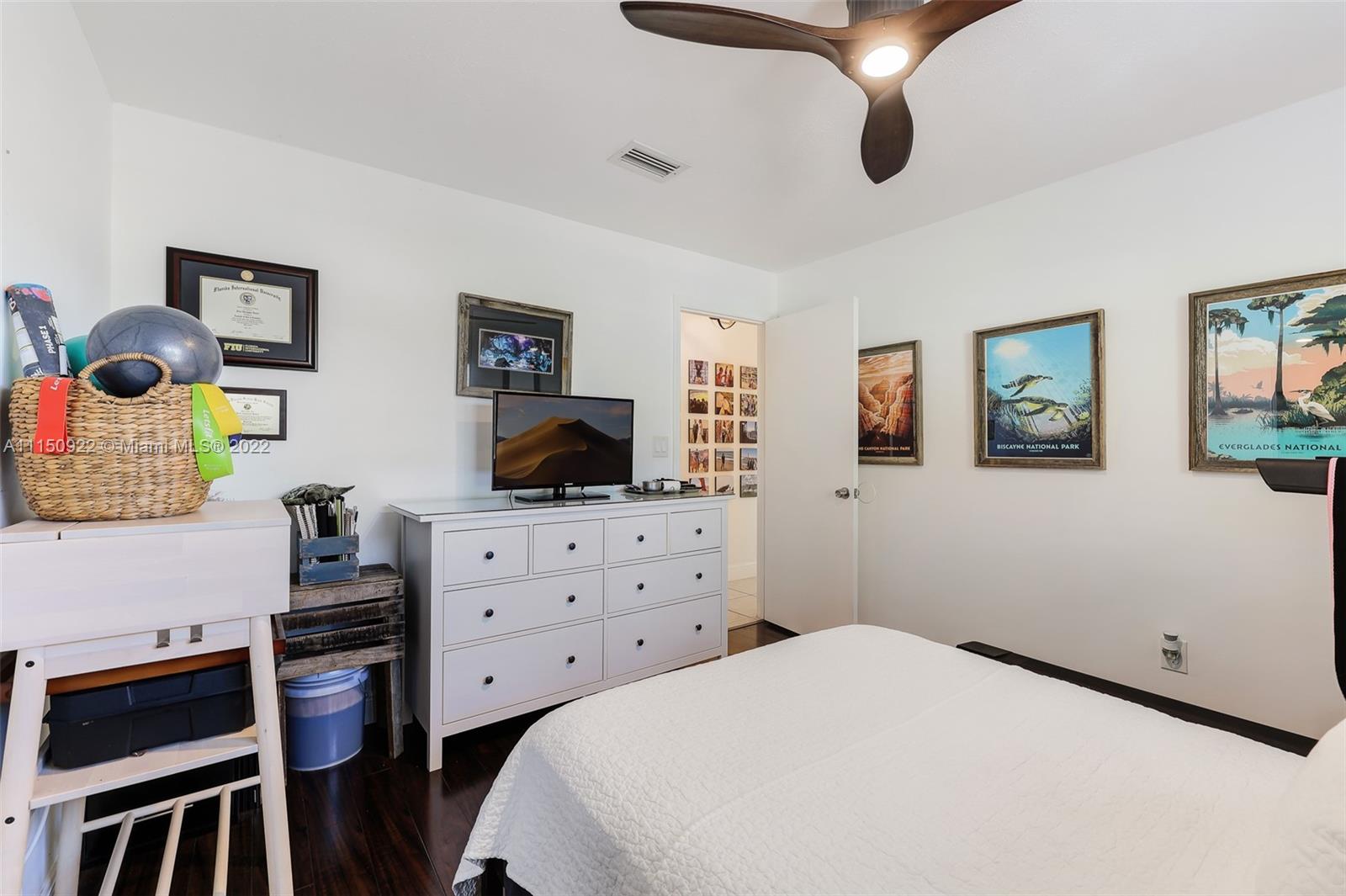 15534 Southwest 153rd Street Miami, FL 33187 - Photo 23 of 44 a bedroom with a bed and furniture