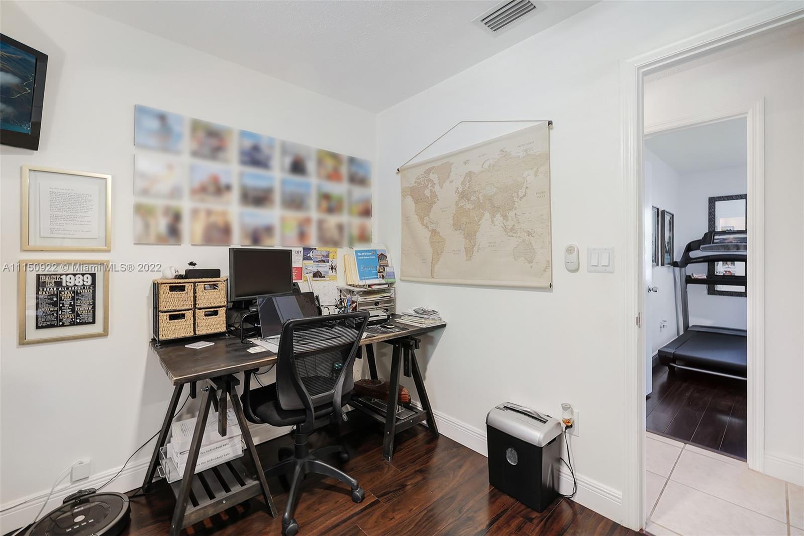 15534 Southwest 153rd Street Miami, FL 33187 - Photo 25 of 44 a view of a workspace with furniture and a window