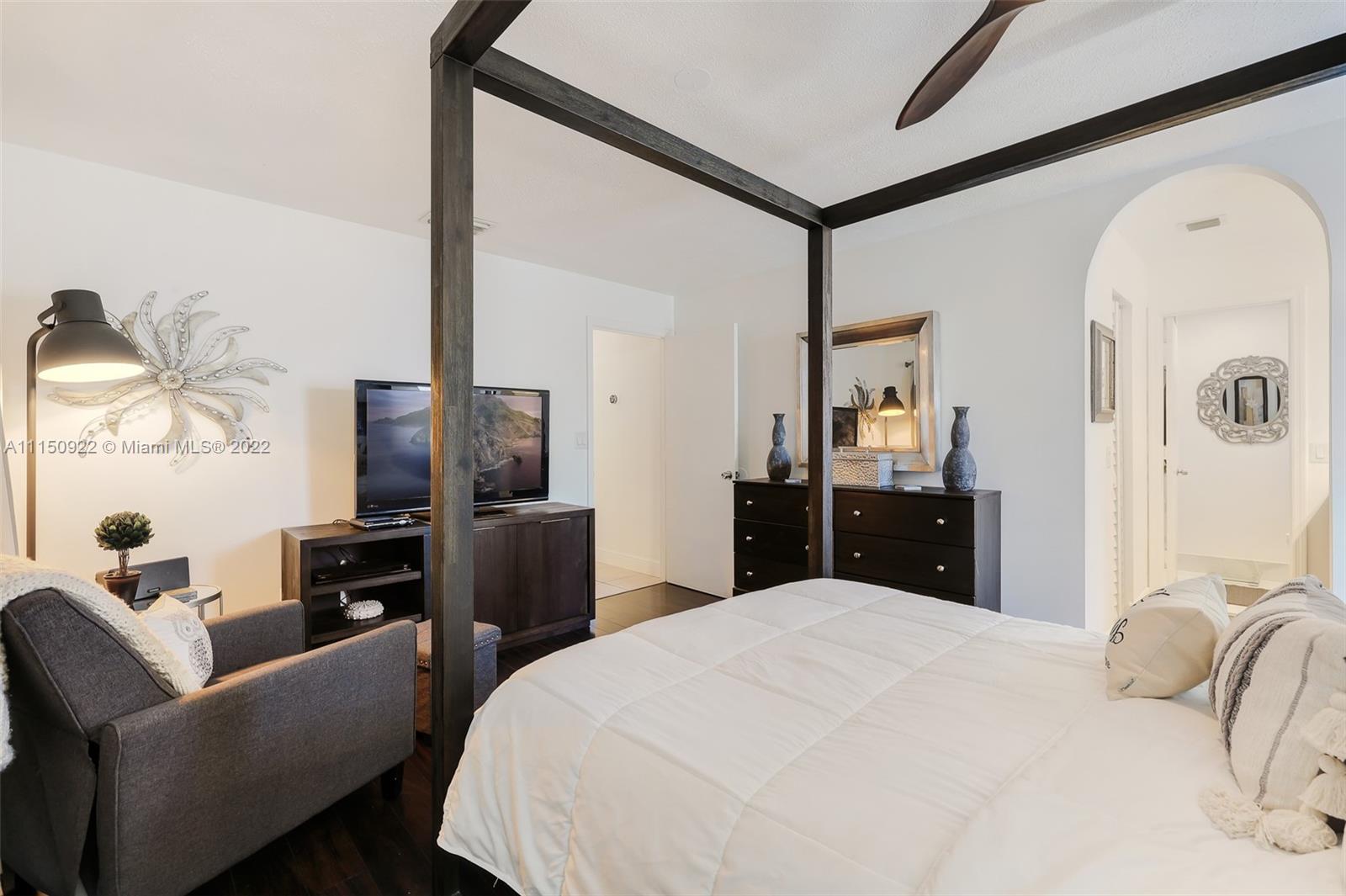 15534 Southwest 153rd Street Miami, FL 33187 - Photo 28 of 44 a bedroom with a bed and a television