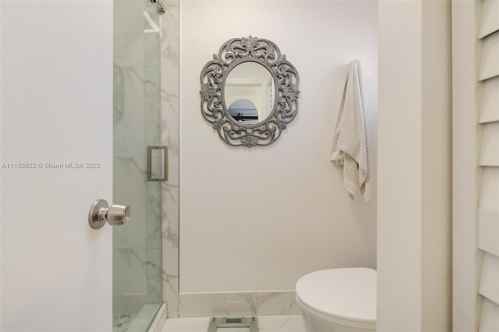 15534 Southwest 153rd Street Miami, FL 33187 - Photo 30 of 44 a bathroom with a toilet and a sink