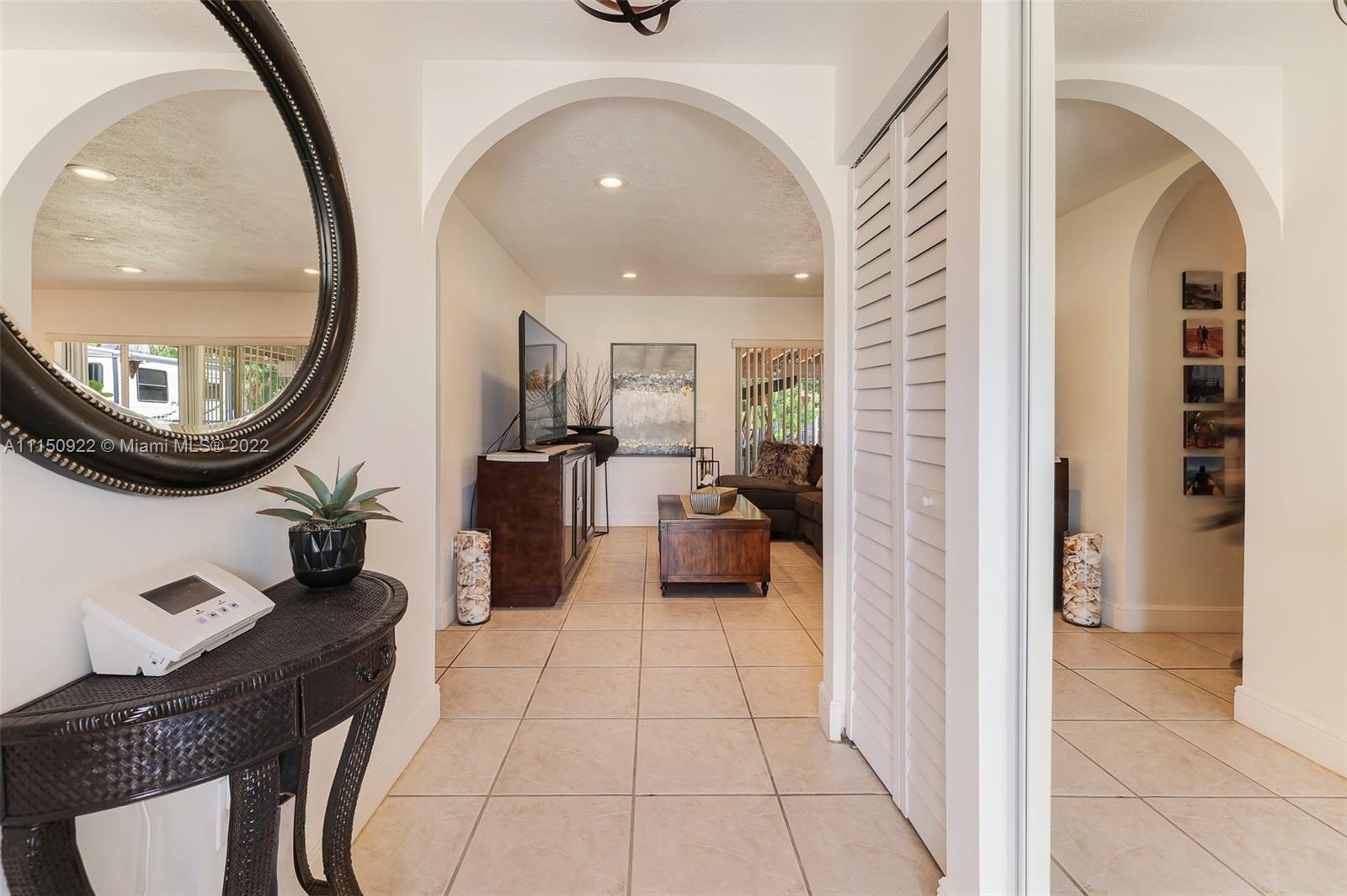 15534 Southwest 153rd Street Miami, FL 33187 - Photo 3 of 44 a view of a livingroom with furniture and a mirror