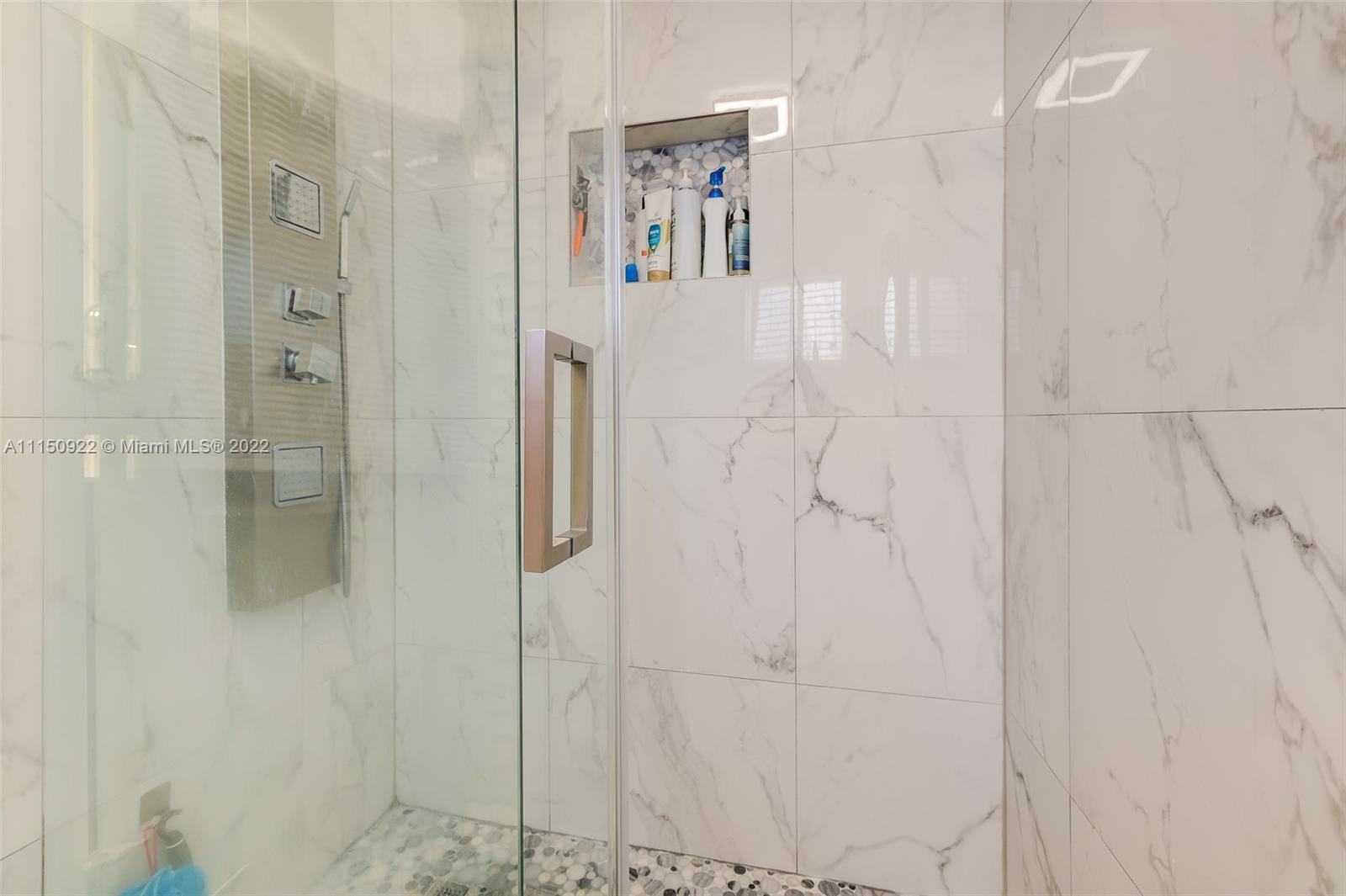 15534 Southwest 153rd Street Miami, FL 33187 - Photo 31 of 44 a bathroom with a shower