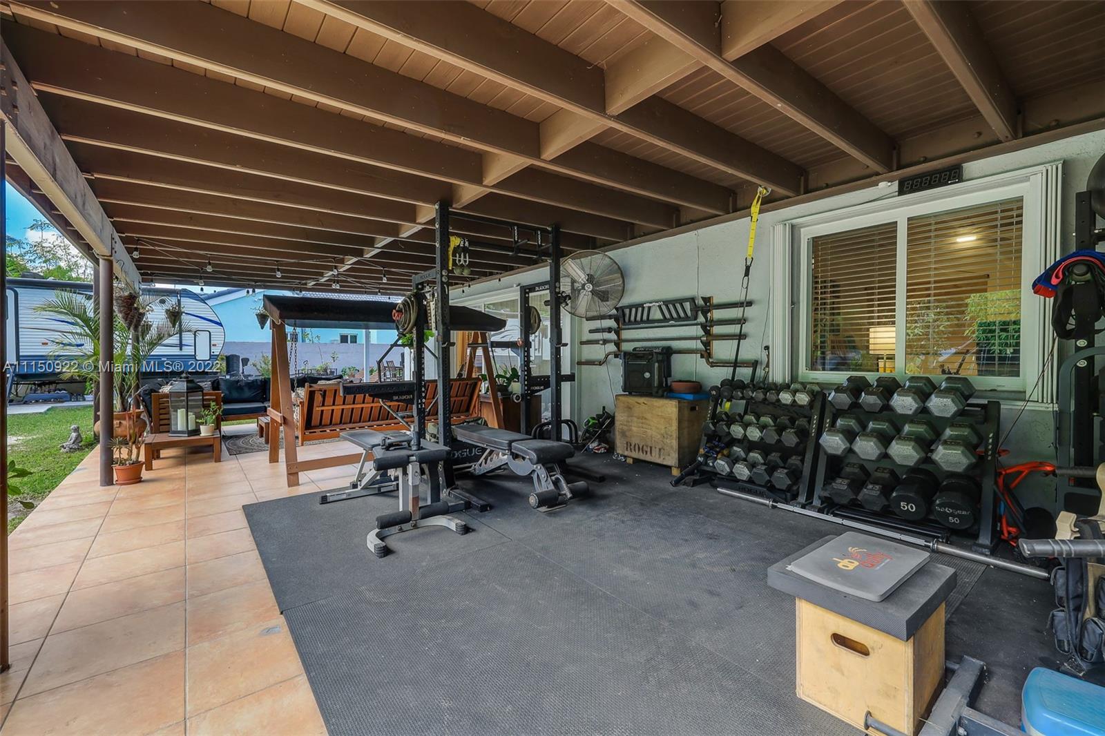 15534 Southwest 153rd Street Miami, FL 33187 - Photo 34 of 44 a view of a room with gym equipment